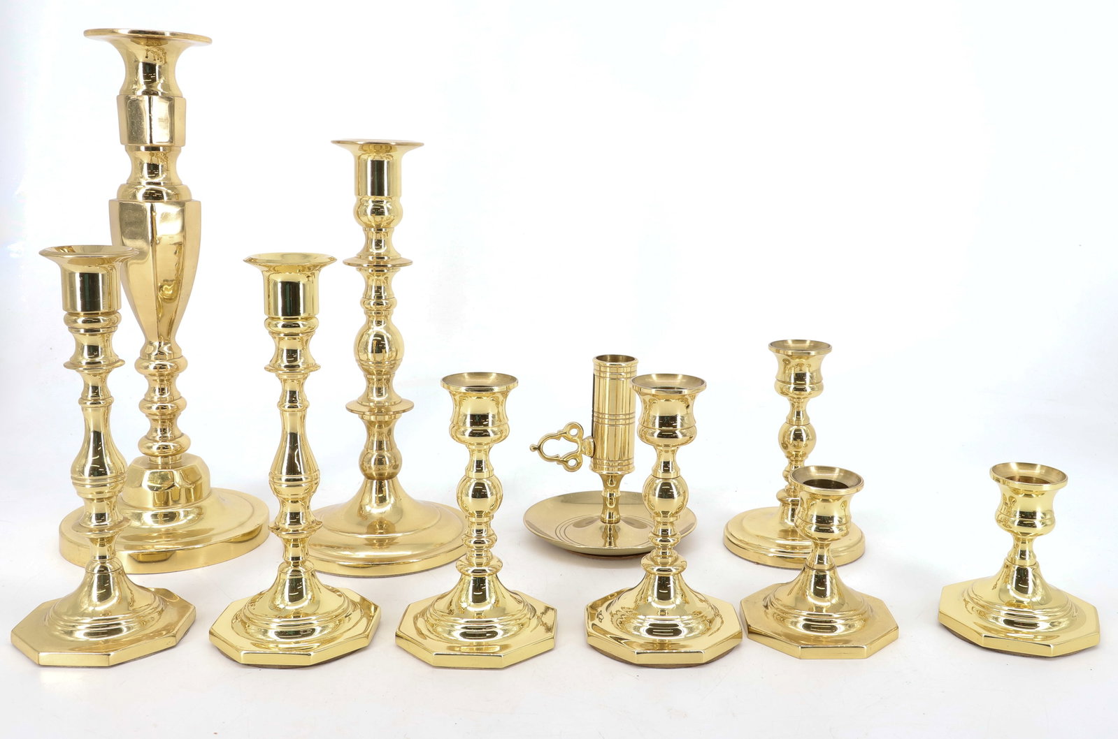 (10) BALDWIN BRASS CANDLESTICKS: (4) SINGLE STICKS AND (3) PAIR ALL BALDWIN BRASS POLISHED WITH FELT BASES 3" TO 11 1/4" PLEASE READ CAREFULLY - ITEMS MUST BE PAID FOR THROUGH LIVE AUCTIONEERS OR WITH CASH OR CHECK IN PERSON - Terms