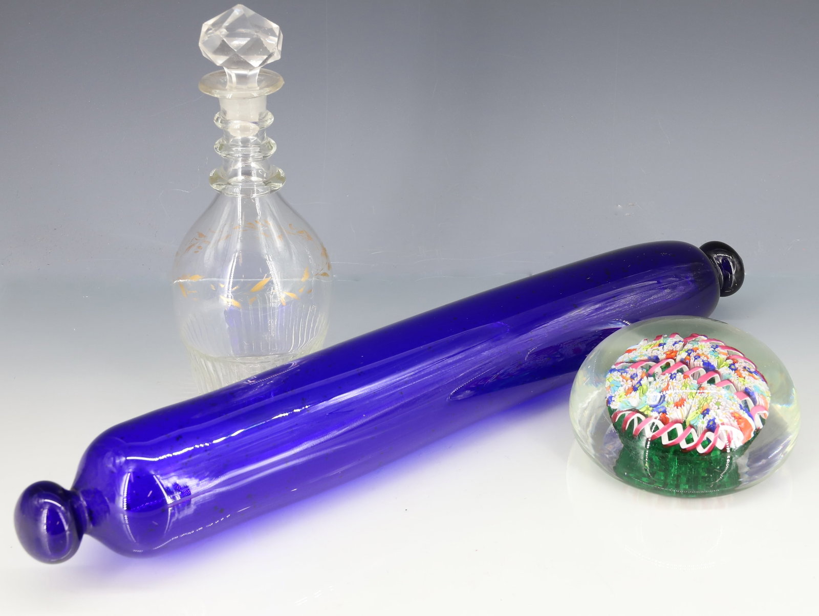 ART GLASS FLORAL MILLEFIORI CANES PAPERWEIGHT: MURANO-STYLE FLORAL CLUSTERS WITH PINK AND WHITE RIBBONS, POLISHED PONTIL. 4 1/4" D. WITH, SMALL BLOWN GLASS DECANTER W/ STOPPER AND COBALT BLUE GLASS ROLLING PIN (15 1/4" L.) PLEASE READ CAREFULLY - 