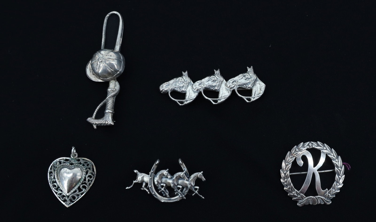 LOT OF VINTAGE STERLING SILVER JEWELRY: (3) EQUESTRIAN / HORSE RELATED PINS (TWO MRKD. BEAU STERLING). WITH, "K" AND HEART MRKD. DANECRAFT. LARGEST 2 5/8" L. ALL STERLING. PLEASE READ CAREFULLY - ITEMS MUST BE PAID FOR THROUGH LIVE AUCTIONE