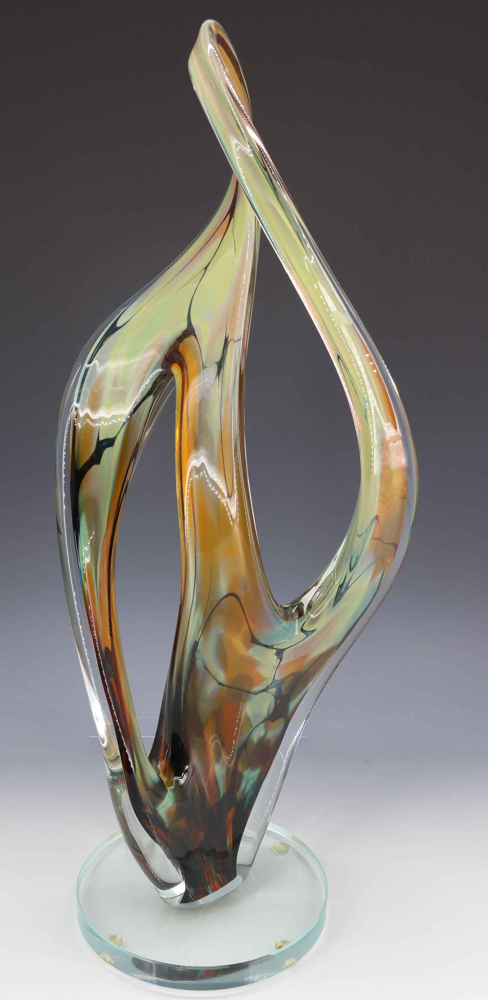 JOHN MCDONALD ART GLASS SCULPTURE: FREEFORM CASED COLOR GLASS SCULPTURE SIGNED ON SIDE ON BASE 22 1/2" X 9" PLEASE READ CAREFULLY - ITEMS MUST BE PAID FOR THROUGH LIVE AUCTIONEERS OR WITH CASH OR CHECK IN PERSON - Terms for Purchasing