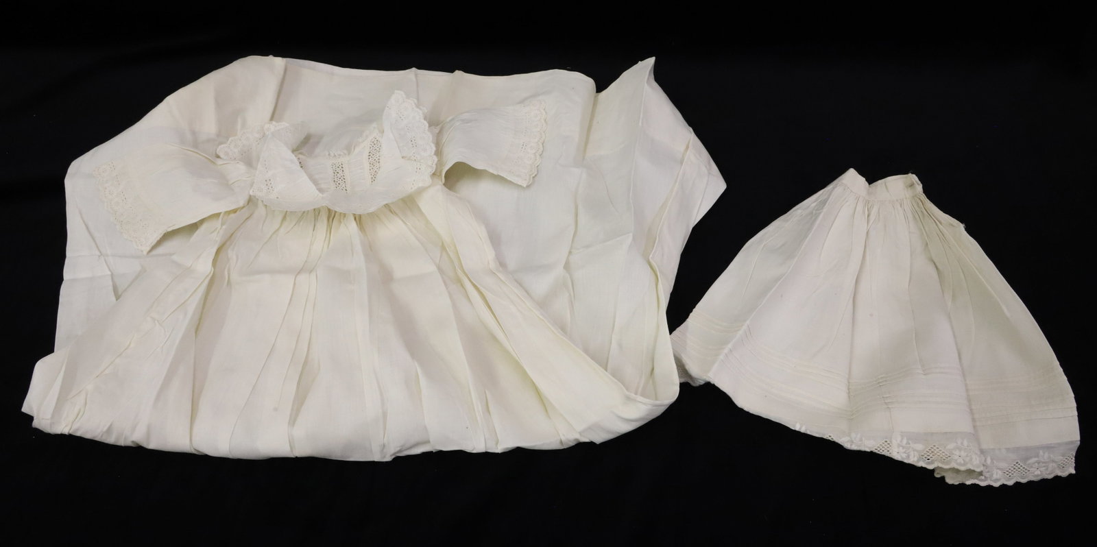 (14) ANTIQUE DOLL AND CHILDS CLOTHING: PINK SILK DRESS WITH LACE COLLAR, WHITE DRESSES, SLIPS, BLOOMERS AND EMBROIDERED DRAWSTRING BAG ALL PRESSED 4" TO 29" H PLEASE READ CAREFULLY - ITEMS MUST BE PAID FOR THROUGH LIVE AUCTIONEERS OR WITH