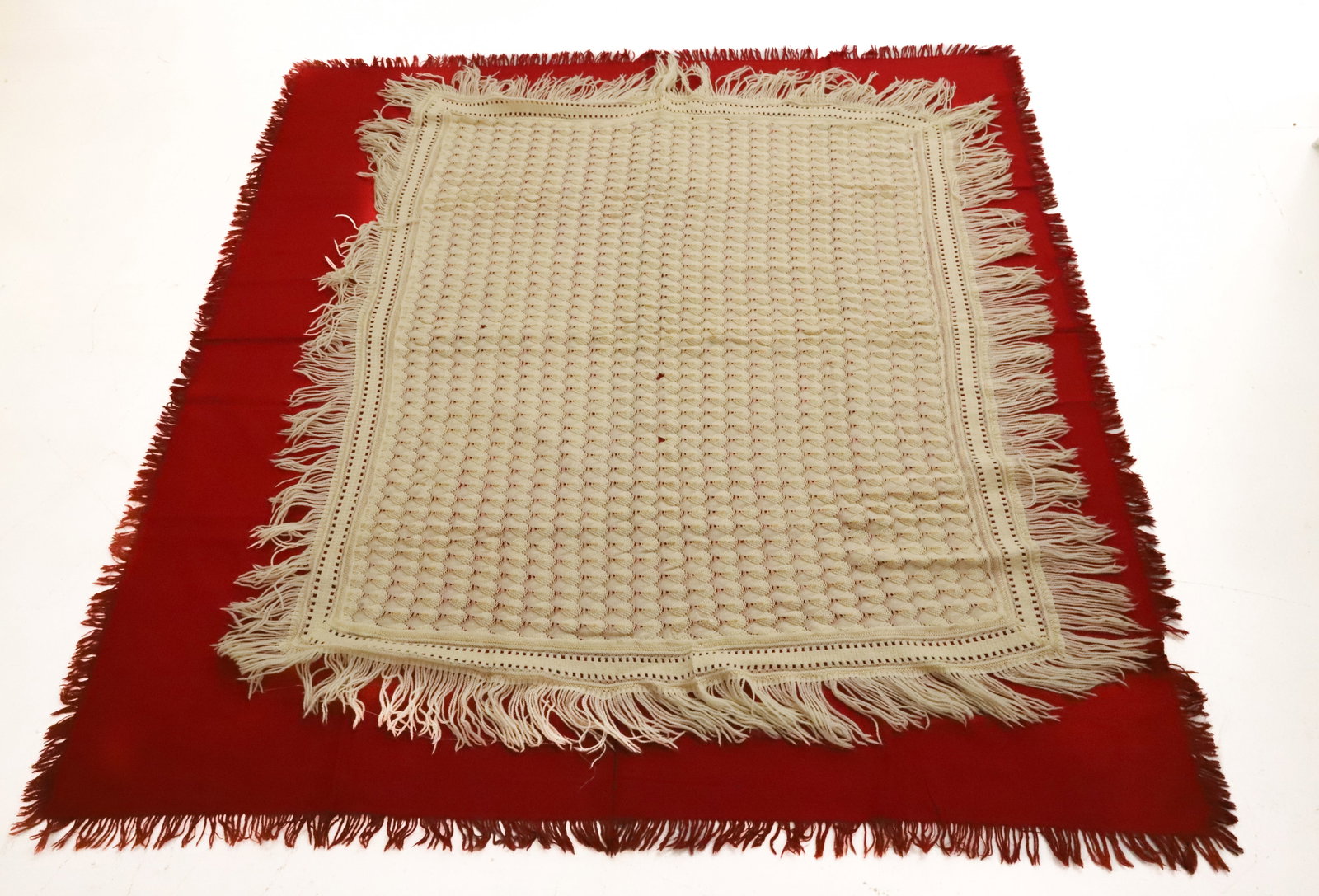 (2) PERSIAN WOOL RED SHAWL AND WHITE SHAWL: CROCHETED OFF WHITE SHAW AND RED PERSIAN WOOL SHAW 63 1/2" X 66", 55" X 49" PLEASE READ CAREFULLY - ITEMS MUST BE PAID FOR THROUGH LIVE AUCTIONEERS OR WITH CASH OR CHECK IN PERSON - Terms for
