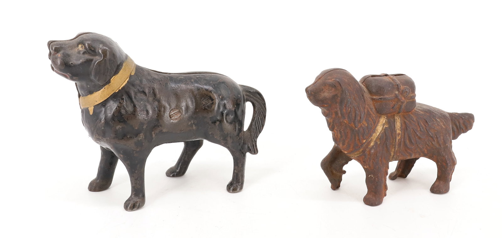 (2) CAST IRON DOG BANKS: LARGER PAINTED BLACK AND GOLD. 6" L. SMALLER HAS GOLD HIGHLIGHTS WITH PACKAGE ON BACK. 5 1/2" L. PLEASE READ CAREFULLY - ITEMS MUST BE PAID FOR THROUGH LIVE AUCTIONEERS OR WITH CASH OR CHECK IN PERSON
