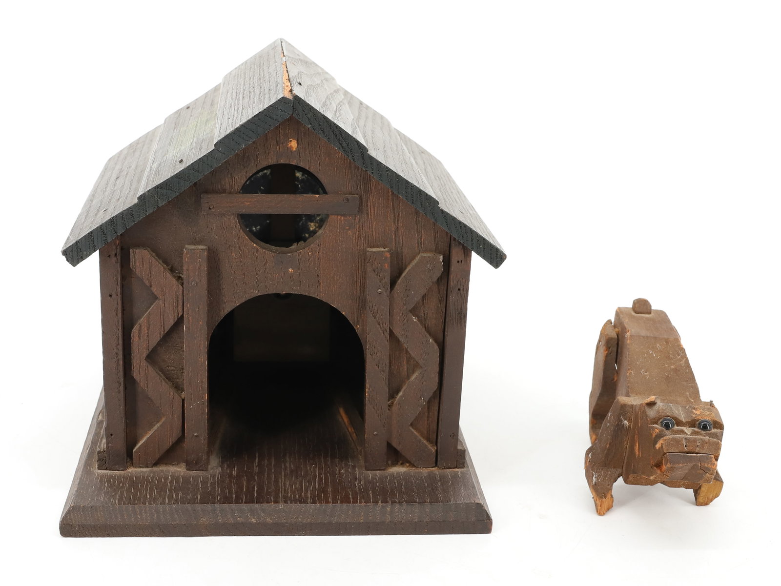 ANTIQUE "THE WIRELESS PUP" TOY: CARVED WOODEN DOG HOUSE WITH DOG. PAINTED SURFACE. PLACARD ON BACK READS " THE NATIONAL TOY CO. THE WIRELESS PUP, PATENT 1913/1914". 7" X 8 1/4" X 7". PLEASE READ CAREFULLY - ITEMS MUST BE PAID FOR