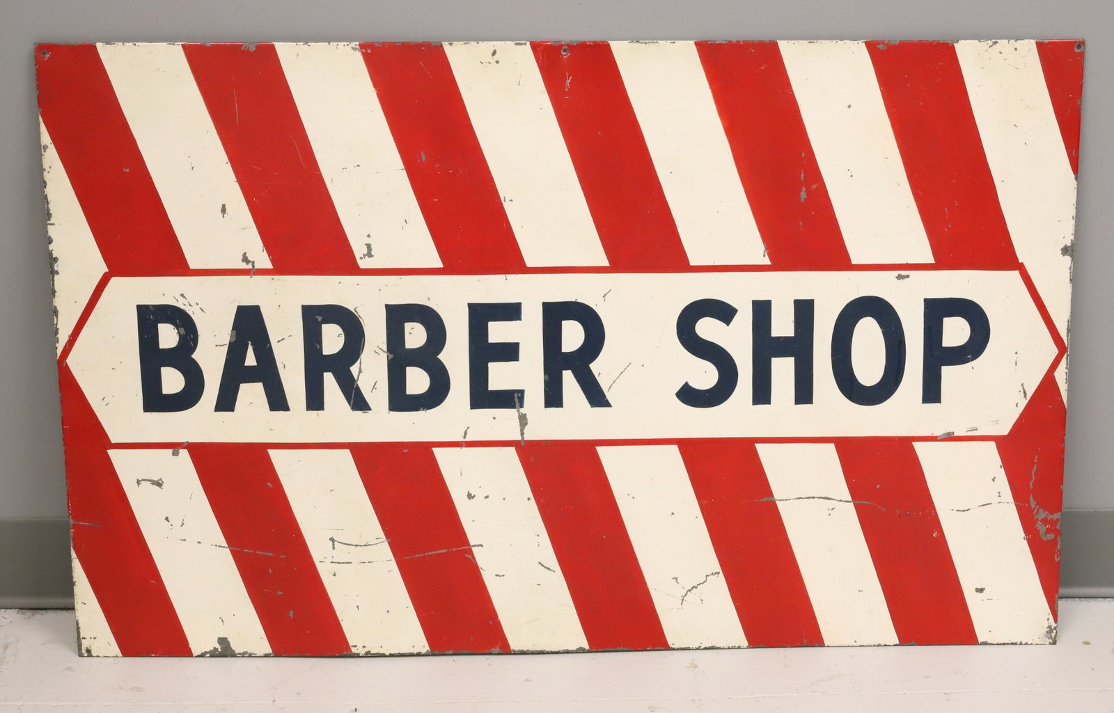 PAINTED METAL "BARBER SHOP" SIGN: RED / WHITE STRIPE W/ BLUE "BARBER SHOP" 24" X 39". PLEASE READ CAREFULLY - ITEMS MUST BE PAID FOR THROUGH LIVE AUCTIONEERS OR WITH CASH OR CHECK IN PERSON - Terms for Purchasing and Shipping of Aucti