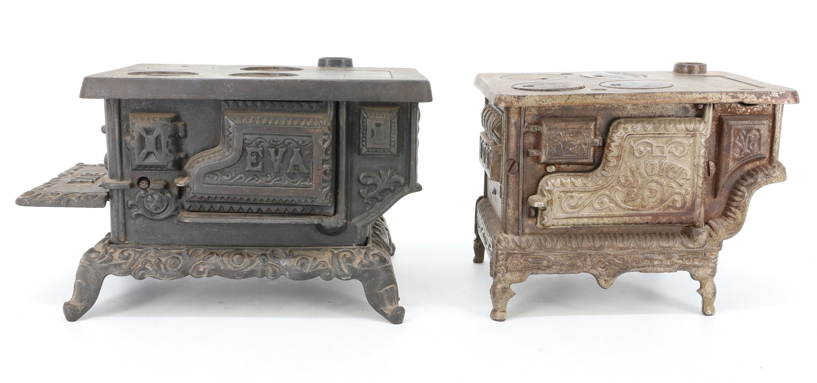 (2) CAST IRON MINIATURE STOVES: (2) TOY STOVES: LARGER MRKD. "EVA" 5 1/4" X 9" X 5 1/4". SMALLER MRKD. "CHOICE, PAT PENDING". PLEASE READ CAREFULLY - ITEMS MUST BE PAID FOR THROUGH LIVE AUCTIONEERS OR WITH CASH OR CHECK IN PERSON - 