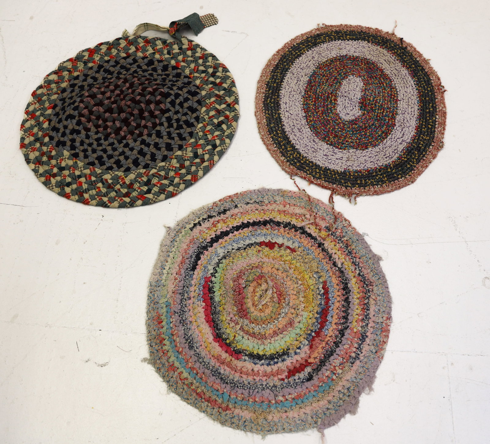 (3) HANDMADE THROW RUGS: ROUND RAG RUGS. LARGEST 25" D. PLEASE READ CAREFULLY - ITEMS MUST BE PAID FOR THROUGH LIVE AUCTIONEERS OR WITH CASH OR CHECK IN PERSON - Terms for Purchasing and Shipping of Auction Items. Please read