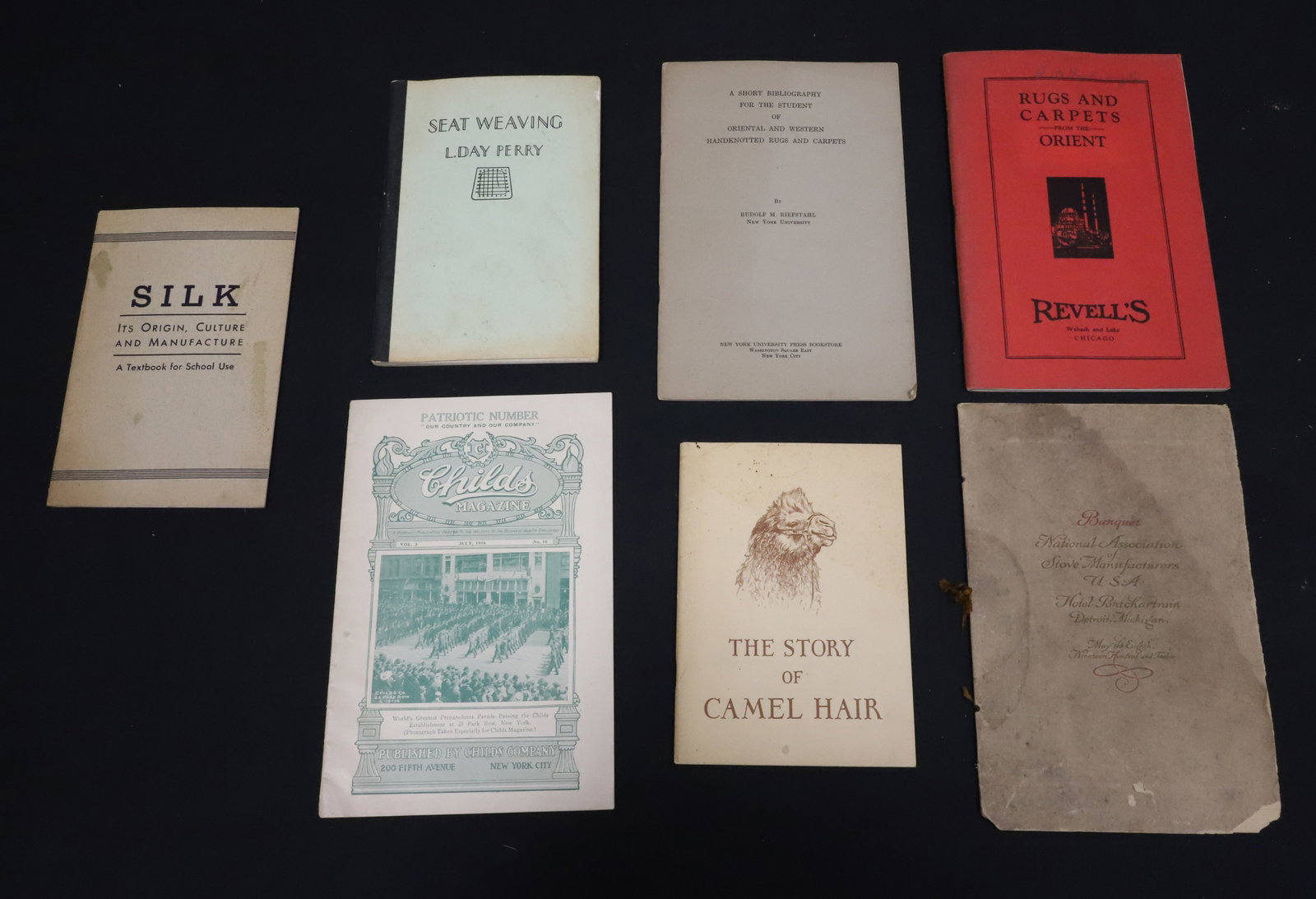 LOT OF REFERENCE PAMPHLETS / BOOKS: INCLUDING: THE STORY OF CAMEL HAIR. SILK, ITS ORIGIN, CULTURE AND MANUFACTURE. RUGS AND CARPETS FROM THE ORIENT. "...ORIENTAL AND WESTERN HAND KNOTTED RUGS AND CARPETS". SEAT WEAVING. "CHILD'S MAGAZIN