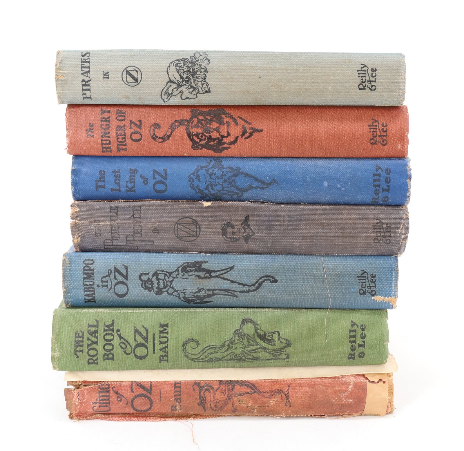 (7) BOOK VOLUMES, L. FRANK BAUM, WIZARD OF OZ SERIES: INCLUDING: GLINDA OF OZ (1920). THE ROYAL BOOK OF OZ (1921). KABUMPO IN OZ (1922). THE PURPLE PRINCE OF OZ (1922). THE LOST KING OF OZ (1925). THE HUNGRY TIGER OF OZ (1926). PIRATES IN OZ (1931). PLEA