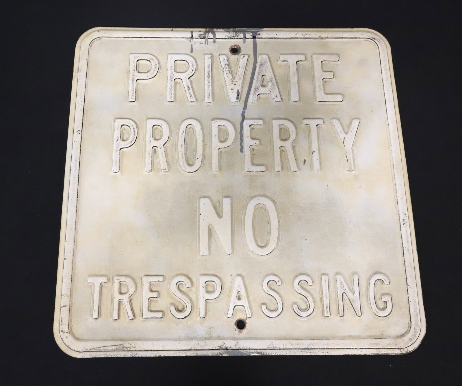 HEAVY METAL "NO TRESPASSING" SIGN: PAINTED SURFACE WITH EMBOSSED LETTERS. 18" X 18". PLEASE READ CAREFULLY - ITEMS MUST BE PAID FOR THROUGH LIVE AUCTIONEERS OR WITH CASH OR CHECK IN PERSON - Terms for Purchasing and Shipping of