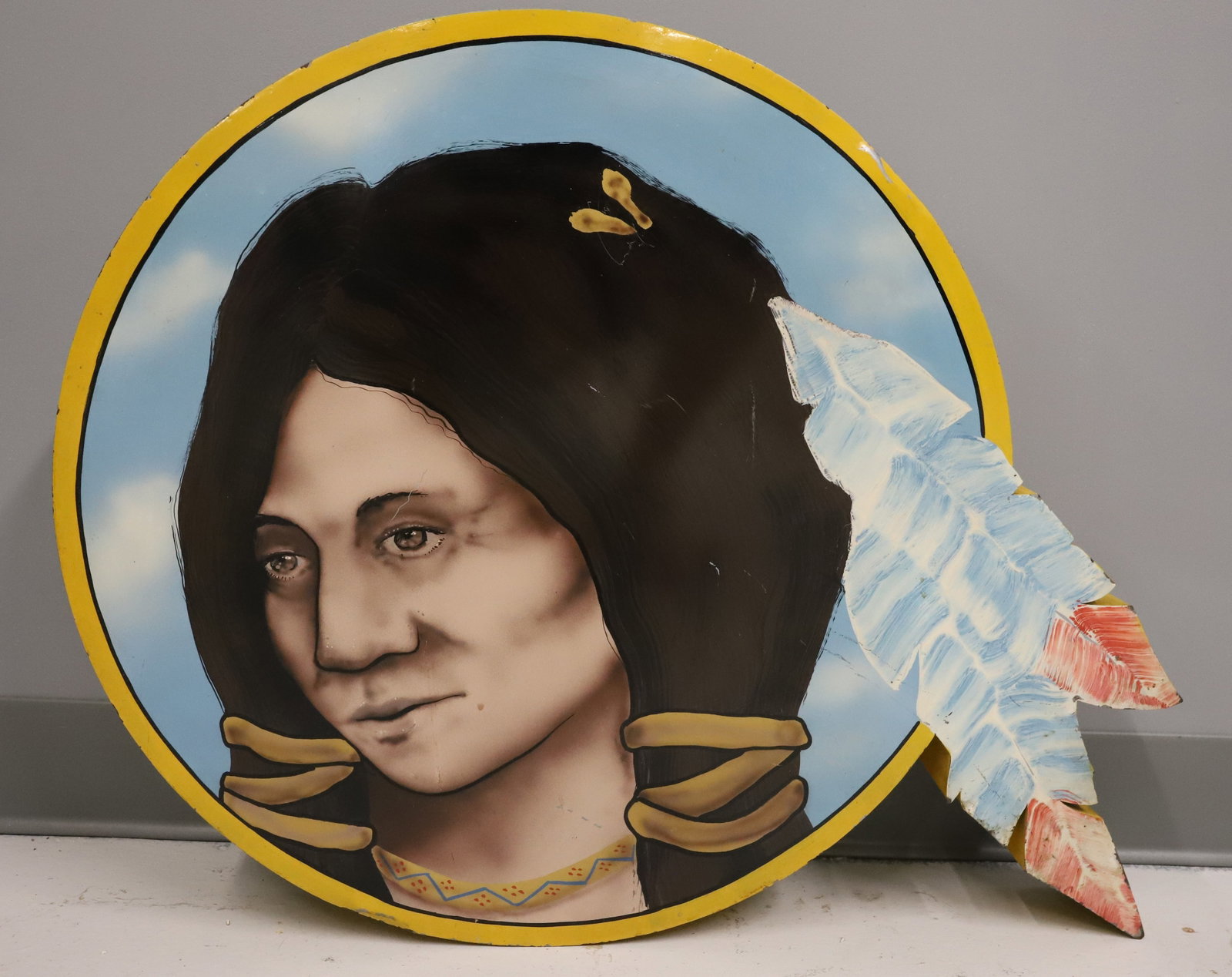 NATIVE AMERICAN PAINTED SIGN: PAINTED METAL DEPICTING INDIAN WITH FEATHERS IN HAIR. CONTEMPORARY. 22" X 28". PLEASE READ CAREFULLY - ITEMS MUST BE PAID FOR THROUGH LIVE AUCTIONEERS OR WITH CASH OR CHECK IN PERSON - Terms for Purch