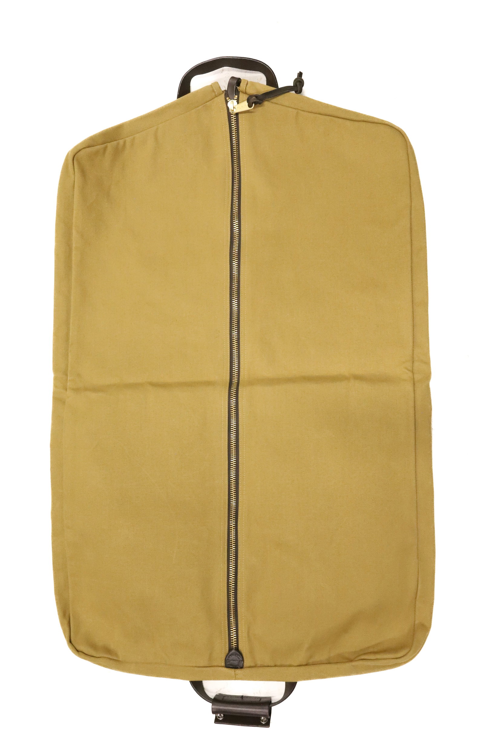 FILSON TWILL CANVAS GARMENT BAG: TAN TWILL CANVAS. BRASS HARDWARE. LEATHER TRIM. 38" X 24 1/2" OPEN. PLEASE READ CAREFULLY - ITEMS MUST BE PAID FOR THROUGH LIVE AUCTIONEERS OR WITH CASH OR CHECK IN PERSON - Terms for Purchasing and