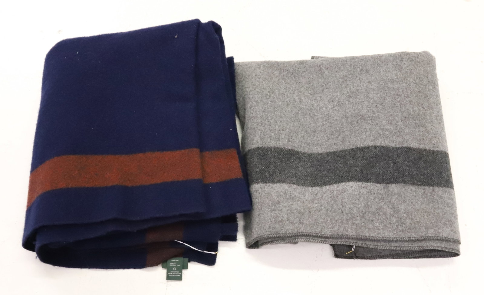(2) WOOLRICH WOOL BLANKETS: GRAY W/ CHARCOAL STRIPES 66" X 60". BLUE / ORANGE 70" X 60". PLEASE READ CAREFULLY - ITEMS MUST BE PAID FOR THROUGH LIVE AUCTIONEERS OR WITH CASH OR CHECK IN PERSON - Terms for Purchasing and
