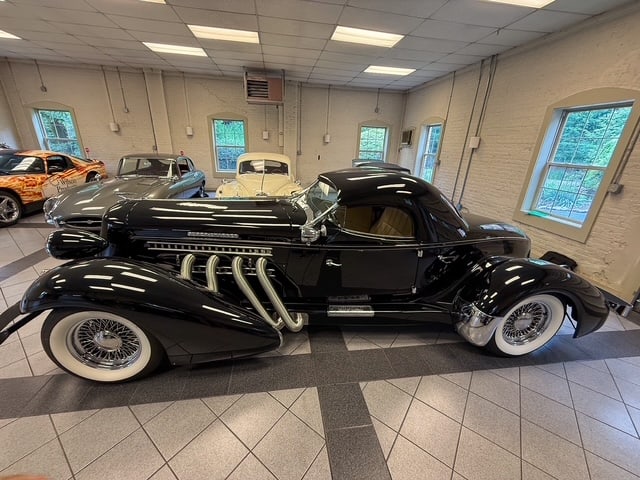 1936 AUBURN BOATTAIL SPEEDSTER REPLICA: 10,691 MILES, VIN#AZ290684, V8 ENGINE WITH 400 HP TURBO AUTOMATIC TRANSMISSION, 2 DOOR OPEN ROADSTER WITH REMOVABLE HARDTOP, BLACK OVER CREAM LEATHER INTERIOR, WITH ALL SERVICE RECORDS AND GARAGE KEPT