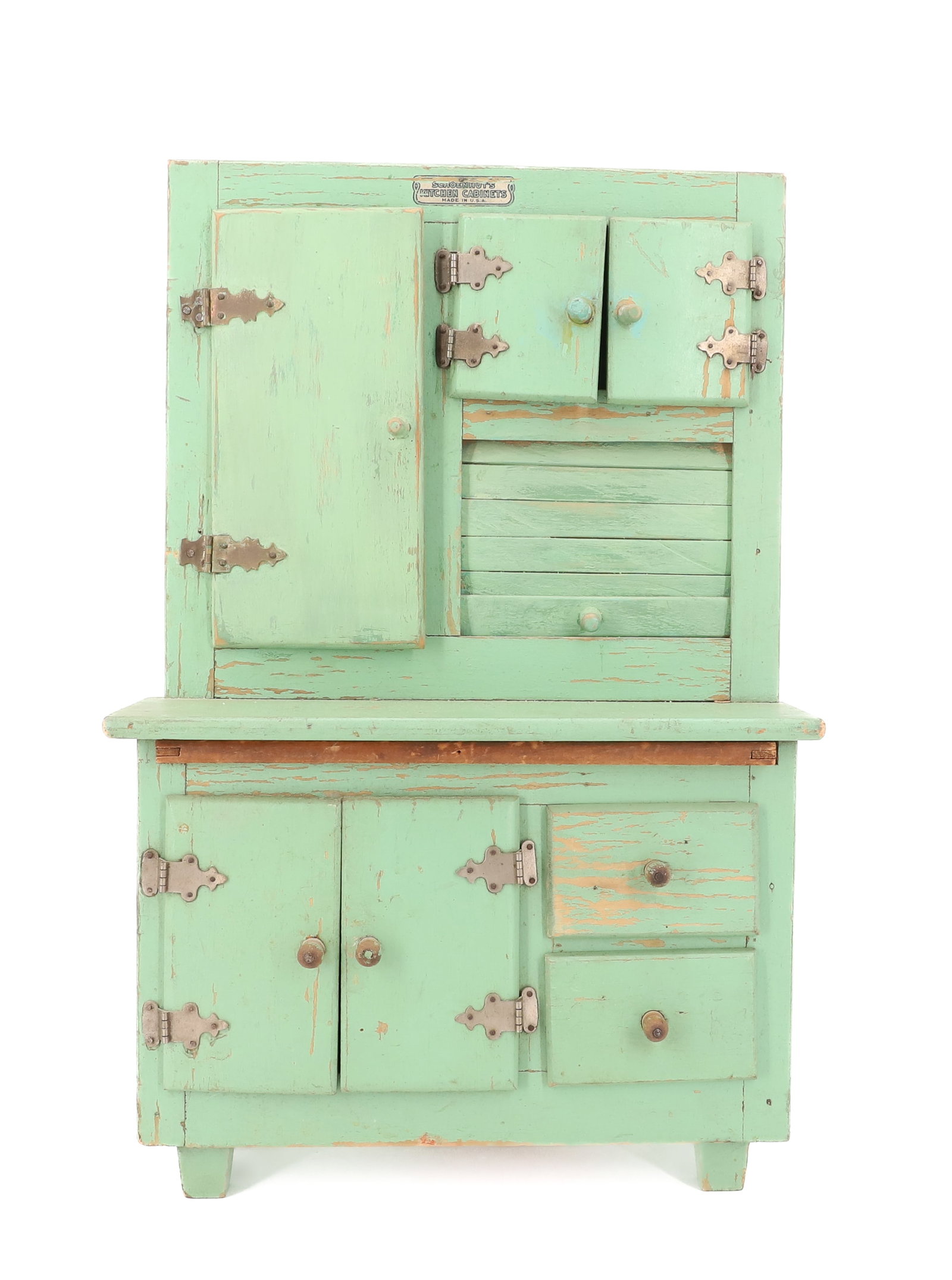 SCHOENHUT TOY HOOSIER CABINET: GREEN PAINTED WOOD. ORIGINAL LABEL AT TOP. TIN FLOUR BIN (INTERIOR). 17 1/4" X 11 1/4" X 7". PLEASE READ CAREFULLY - ITEMS MUST BE PAID FOR THROUGH LIVE AUCTIONEERS OR WITH CASH OR CHECK IN PERSON -
