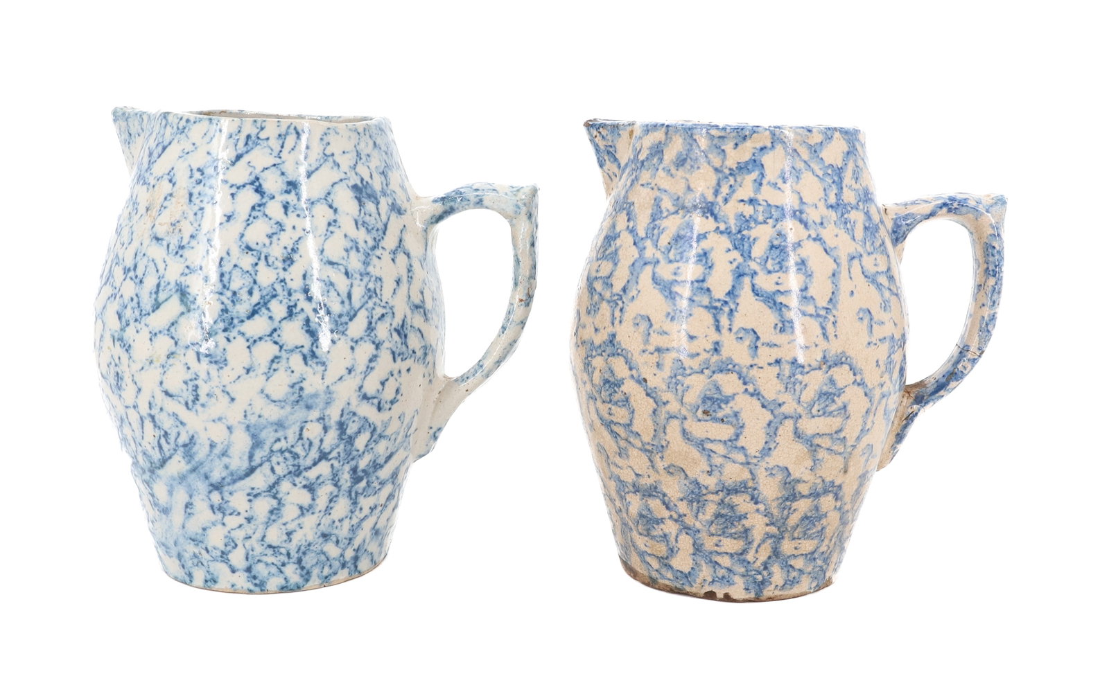 (2) BLUE / WHITE SPONGEWARE PITCHERS: MOLDED PITCHERS WITH APPLIED BLUE DECORATION. 7 1/2" H. PLEASE READ CAREFULLY - ITEMS MUST BE PAID FOR THROUGH LIVE AUCTIONEERS OR WITH CASH OR CHECK IN PERSON - Terms for Purchasing and Shipping of