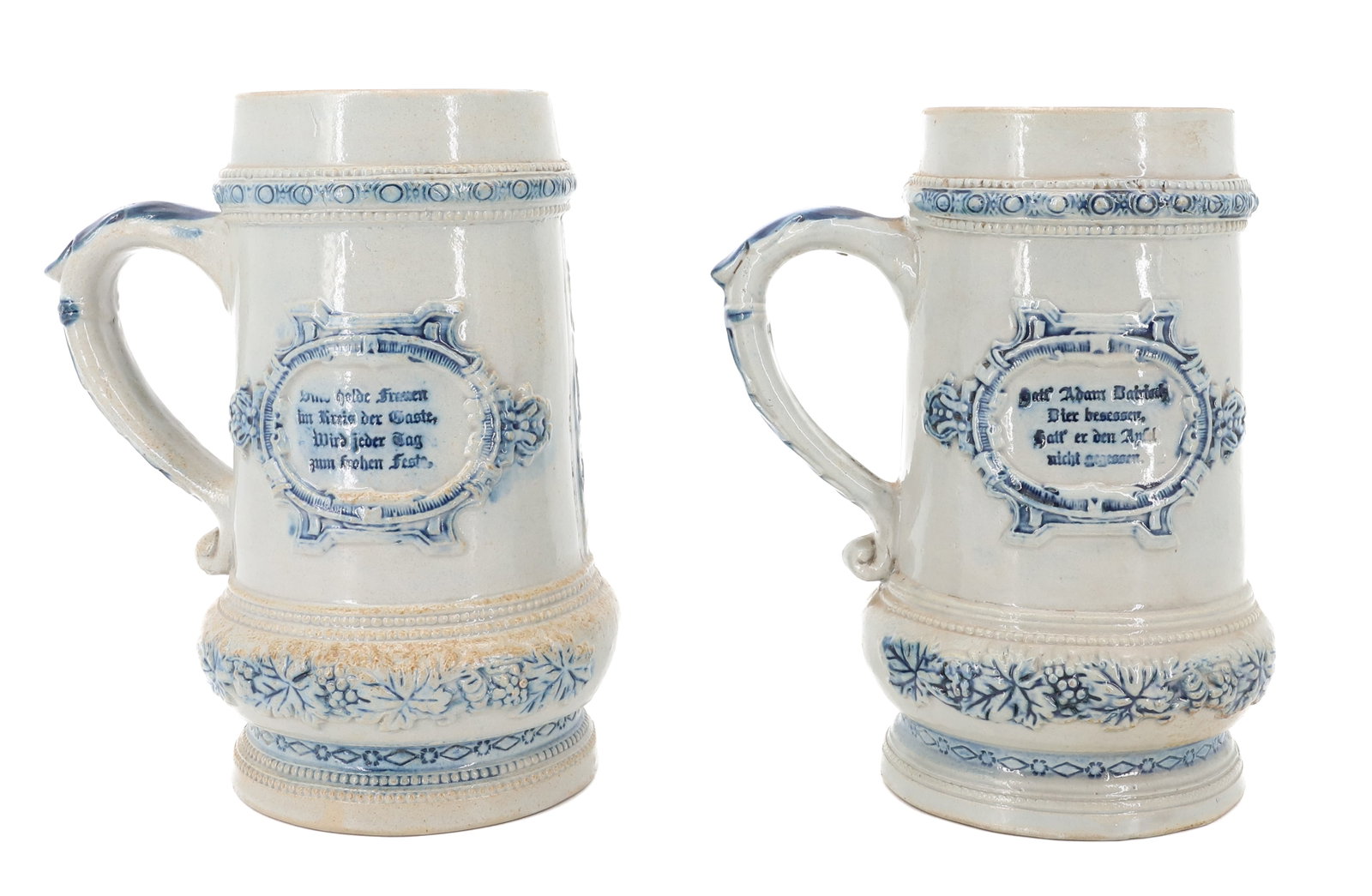 (2) WHITE'S UTICA STONEWARE STEINS: EMBOSSED HESSIAN SOLDIERS WITH BLUE HIGHLIGHTING. 8 1/4" H. MRKD. "39" ON BOTTOM. PLEASE READ CAREFULLY - ITEMS MUST BE PAID FOR THROUGH LIVE AUCTIONEERS OR WITH CASH OR CHECK IN PERSON - Terms for Pu
