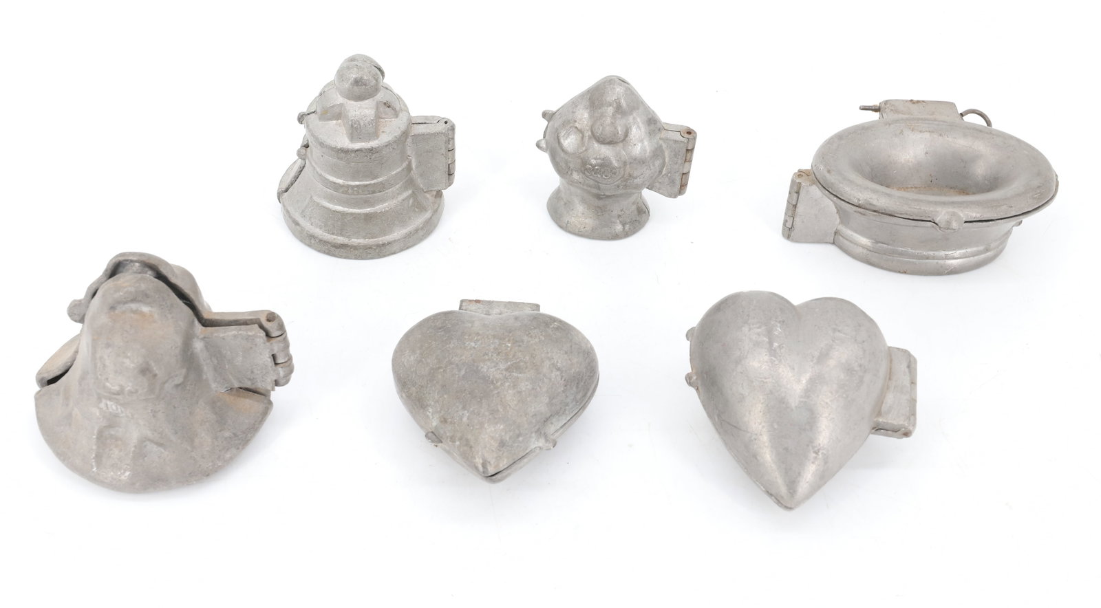 LOT OF (6) PEWTER ICE CREAM MOLDS, CHOCOLATE: INCLUDING: CHERUB ON BELL. (2) PLAIN HEARTS (ONE MRKD. E&CO NY 956). MARRIAGE BELL (285). THREE-PIECE HINGED BASKET (471) 4" L. FLORAL BOUQUET (S&CO. 253). PLEASE READ CAREFULLY - ITEMS MUST BE PAID F