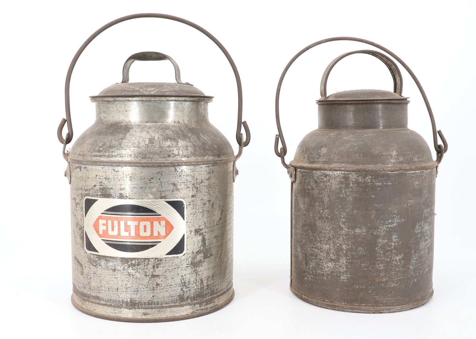 (2) COUNTRY MILK CANS: ONE WITH ORIGINAL "FULTON" LABEL. WIRE HANDLES AND LIDS. 10" AND 10 1/4" HEIGHTS. PLEASE READ CAREFULLY - ITEMS MUST BE PAID FOR THROUGH LIVE AUCTIONEERS OR WITH CASH OR CHECK IN PERSON - Terms for Pu
