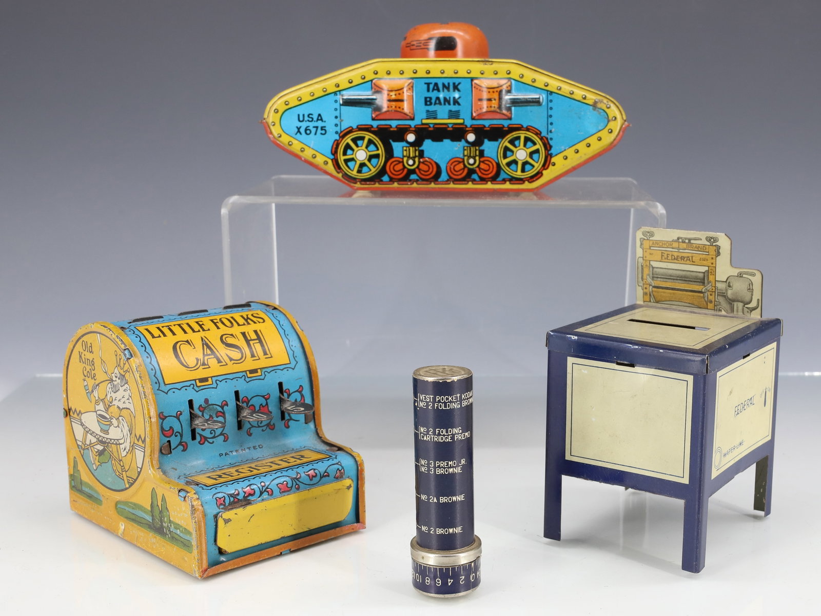 (4) TIN LITHO BANKS: INCLUDING: TANK BANK 6" L. "LITTLE FOLKS CASH REGISTER" (NEW YORK). FEDERAL BRAND WASHING MACHINE (NO BOTTOM). KODAK BANK 3" L. PLEASE READ CAREFULLY - ITEMS MUST BE PAID FOR THROUGH LIVE AUCTIONEERS