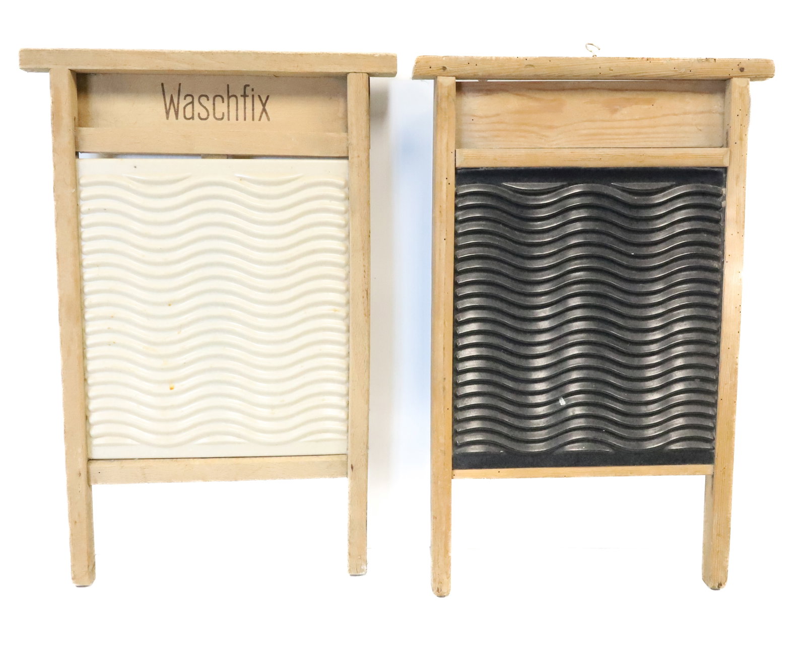 (2) AGATE / WOOD WASHBOARDS: IVORY COLORED WAVY INSERT IN WOODEN FRAMEWORK MRKD. WASCHFIX. 22" X 15". OTHER IS UNMARKED WITH BLACK WAVY INSERT. PLEASE READ CAREFULLY - ITEMS MUST BE PAID FOR THROUGH LIVE AUCTIONEERS OR WITH CASH