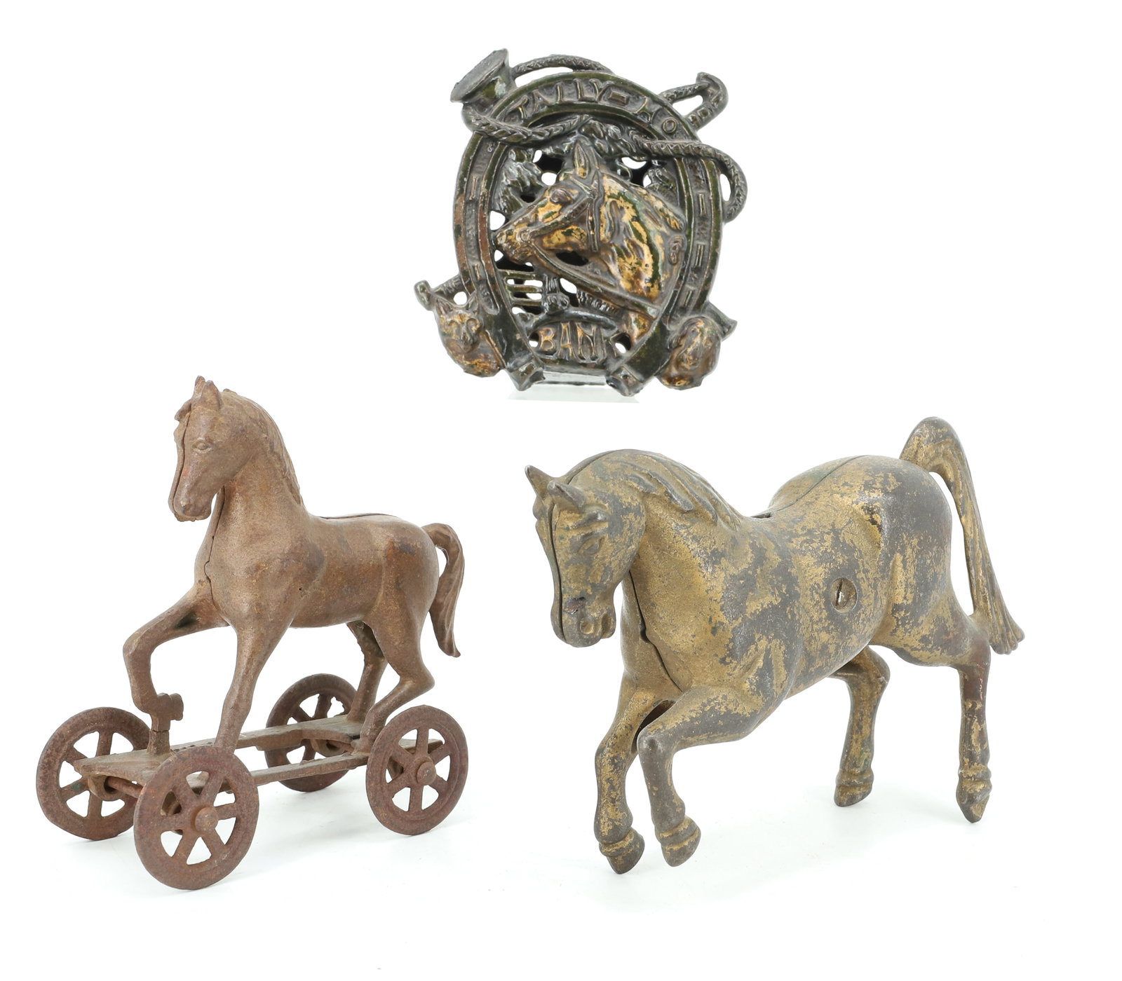 LOT OF (3) CAST IRON HORSE BANKS: LARGEST PRANCING HORSE IN GOLD PAINT. 7 1/4" L. PAINTED HORSE ON PLATFORM WITH WHEELS. 5" X 4 3/4". "TALLY-HO" BANK IN BLACK AND GOLD PAINT. 4 3/4" X 4 1/4". PLEASE READ CAREFULLY - ITEMS MUST BE