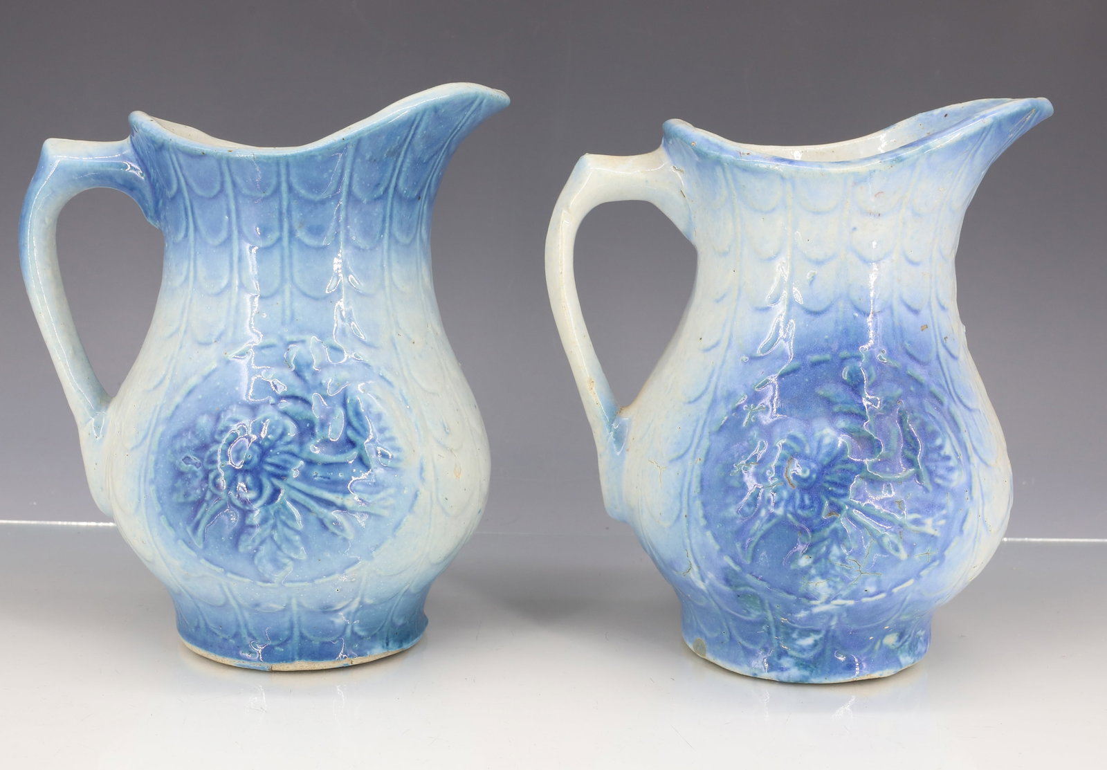(2) BLUE/WHITE STONEWARE PITCHERS (1 of 6)