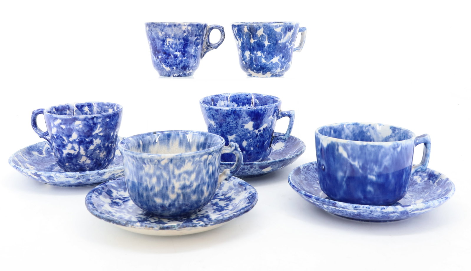 LOT OF SPONGEWARE CUPS / SAUCERS: BLUE / WHITE SPONGING. VARIOUS SIZE AND STYLES. (6) CUPS AND (4) SAUCERS. PLEASE READ CAREFULLY - ITEMS MUST BE PAID FOR THROUGH LIVE AUCTIONEERS OR WITH CASH OR CHECK IN PERSON - Terms for Purchasing
