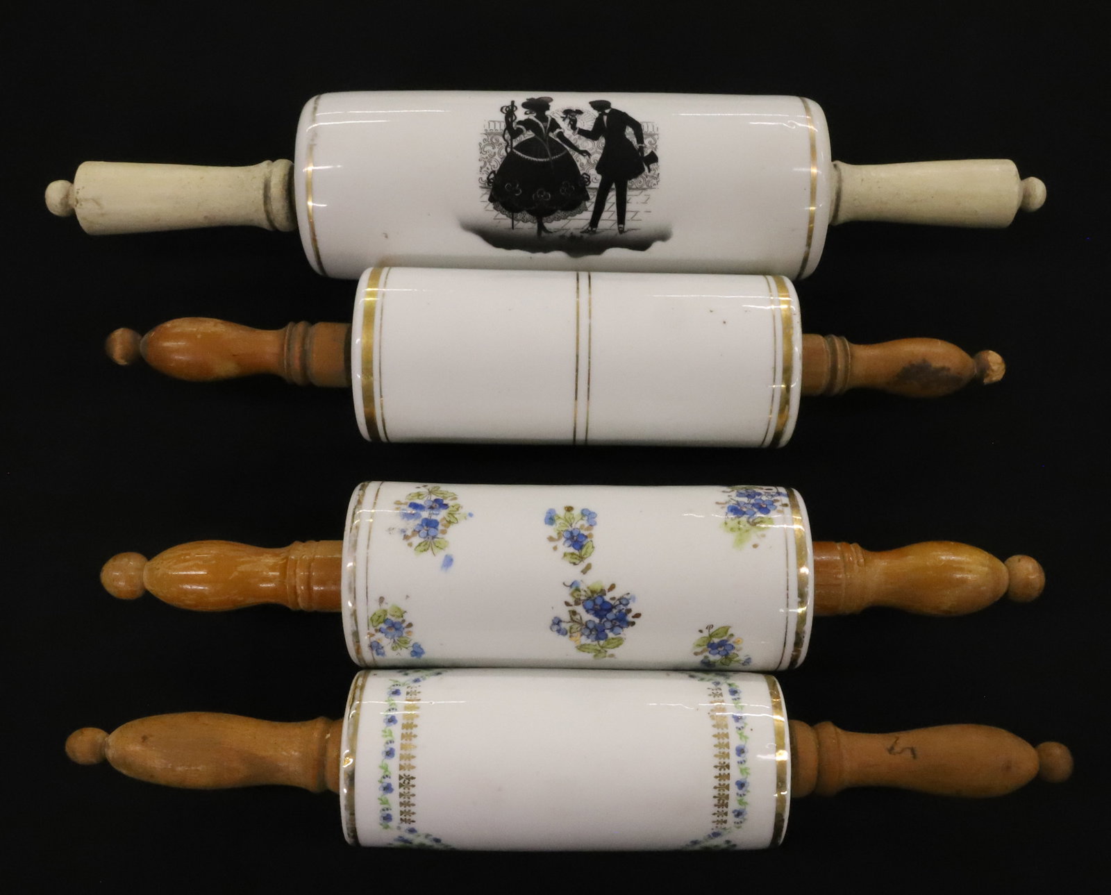 (4) CERAMIC ROLLING PINS: BLUE FLORAL DECORATION AND GOLD BANDING. LARGEST HAS COURTING COUPLE. 14" TO 16" LENGTHS. PLEASE READ CAREFULLY - ITEMS MUST BE PAID FOR THROUGH LIVE AUCTIONEERS OR WITH CASH OR CHECK IN PERSON - Term