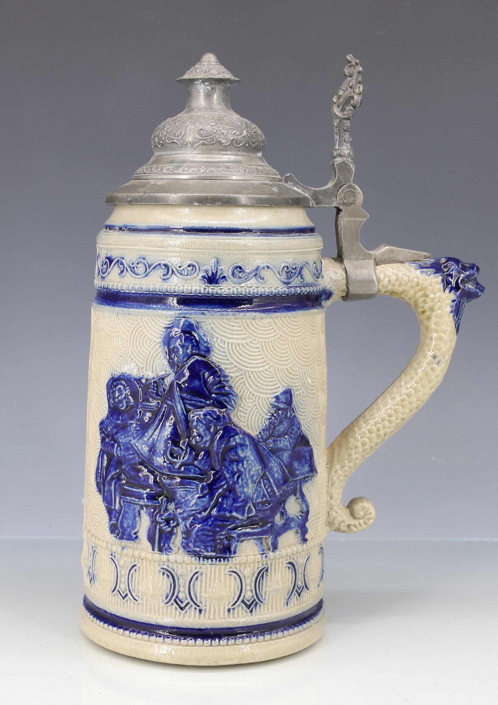 WHITE'S UTICA STONEWARE STEIN, TANKARD: DARK BLUE EMBELLISHMENTS WITH VERSE ON ONE SIDE. PEWTER LID. MRKD. 45 ON BOTTOM. 9" TOTAL HEIGHT. PLEASE READ CAREFULLY - ITEMS MUST BE PAID FOR THROUGH LIVE AUCTIONEERS OR WITH CASH OR CHECK IN