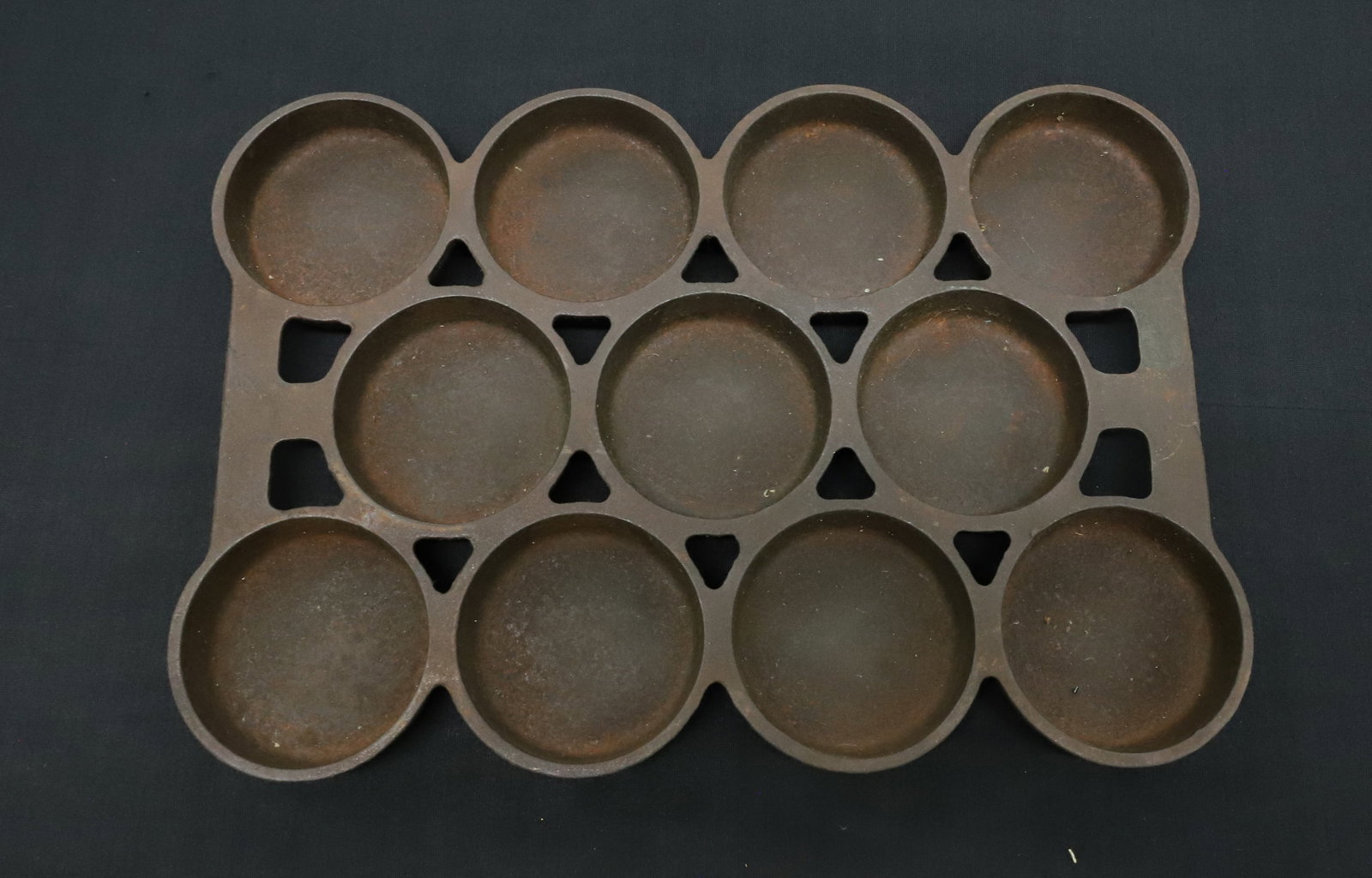 GRISWOLD CAST IRON PAN: MRKD. NO. 1, GRISWOLD, ERIE, PA U.S.A. "940". 11 1/2" X 8". PLEASE READ CAREFULLY - ITEMS MUST BE PAID FOR THROUGH LIVE AUCTIONEERS OR WITH CASH OR CHECK IN PERSON - Terms for Purchasing and Shipping