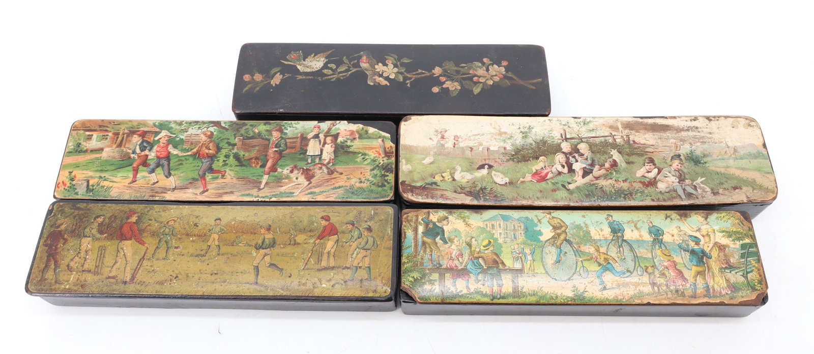 (5) ANTIQUE PENCIL BOXES: PAPIER-MACHE WITH CHILDHOOD SCENES AND FLORAL ON LIDS. KIDS PLAYING CRICKET, KIDS PLAYING (MRKD. GERMANY), KIDS PLAYING WITH ANIMALS, MEN RIDING HIGH WHEEL BICYCLES AND MORE. 7 3/4" TO 8 1/2" LENGTHS.