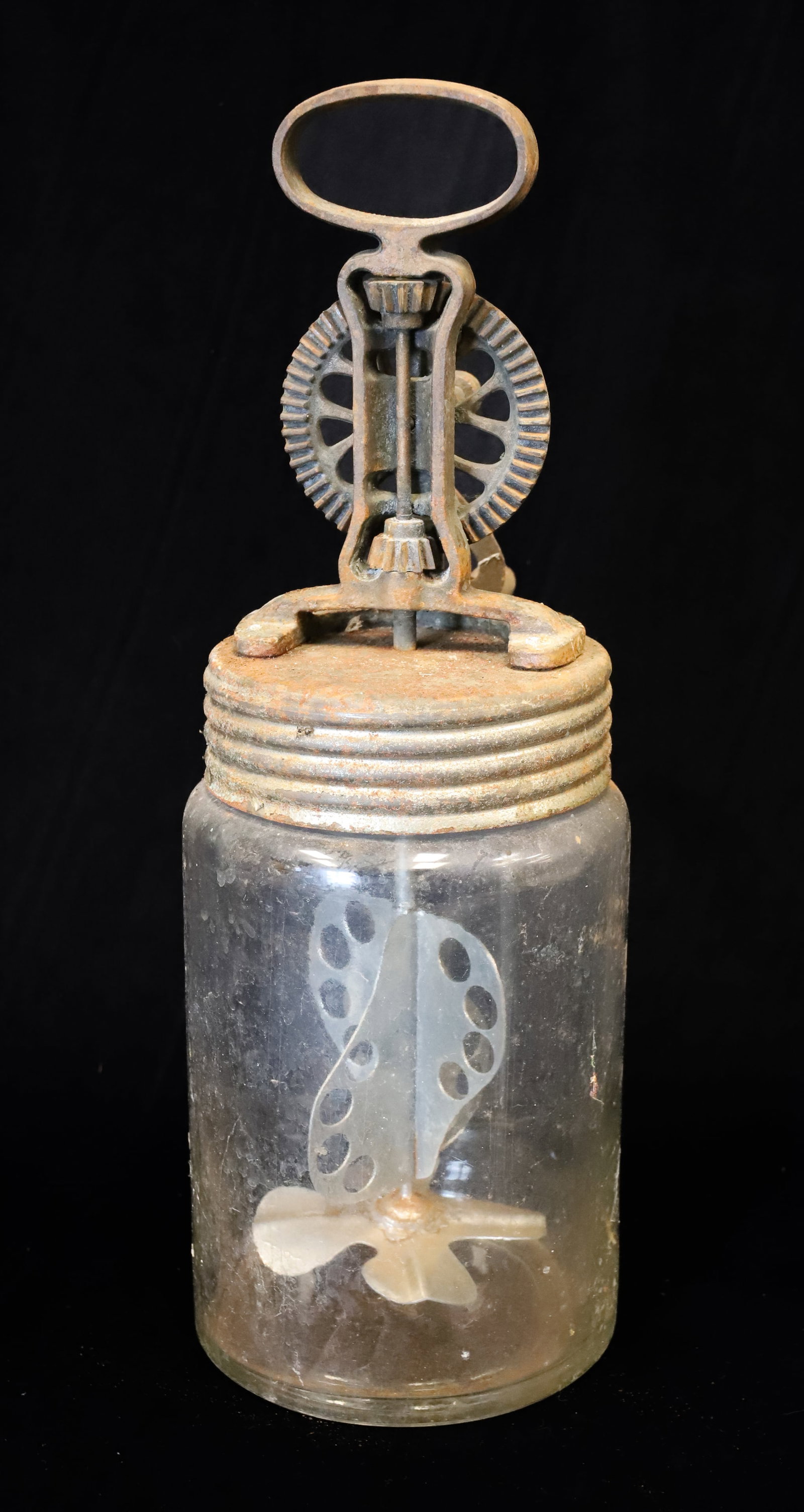 3L GLASS BUTTER CHURN: GLASS WITH METAL LID AND CAST IRON CRANK. UNMARKED. "3L" ON BOTTOM. 16" H. X 5 1/2". PLEASE READ CAREFULLY - ITEMS MUST BE PAID FOR THROUGH LIVE AUCTIONEERS OR WITH CASH OR CHECK IN PERSON - Terms