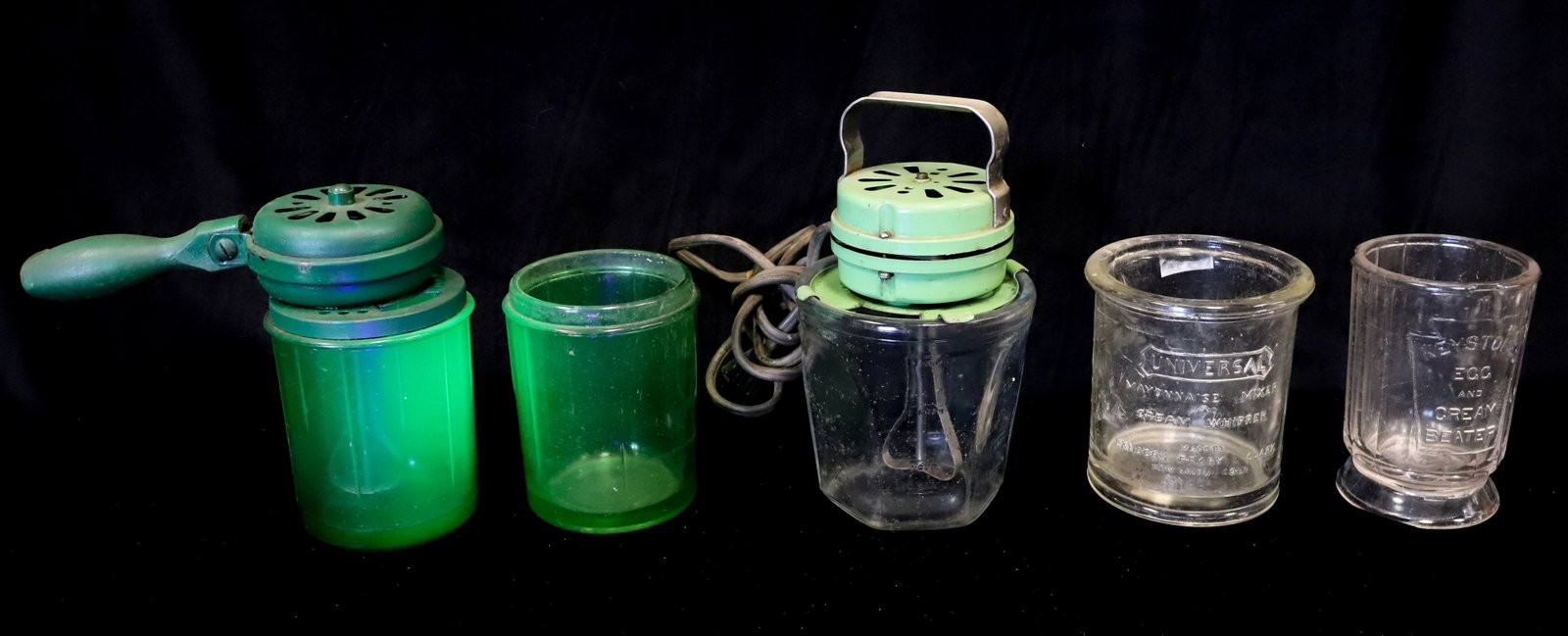 LOT OF VINTAGE DEPRESSION MIXERS, URANIUM GLASS: GREEN URANIUM GLASS W/ HANDLE / MOTOR. MRKD. "VIDRIO PRODUCTS CORP. CICERO, ILL." PLUS, EXTRA GREEN GLASS BASE W/ SAME MARKING. GREEN MOTOR ON CLEAR EMBOSSED BASE. WITH, TWO CLEAR BASES (KEYSTONE EGG
