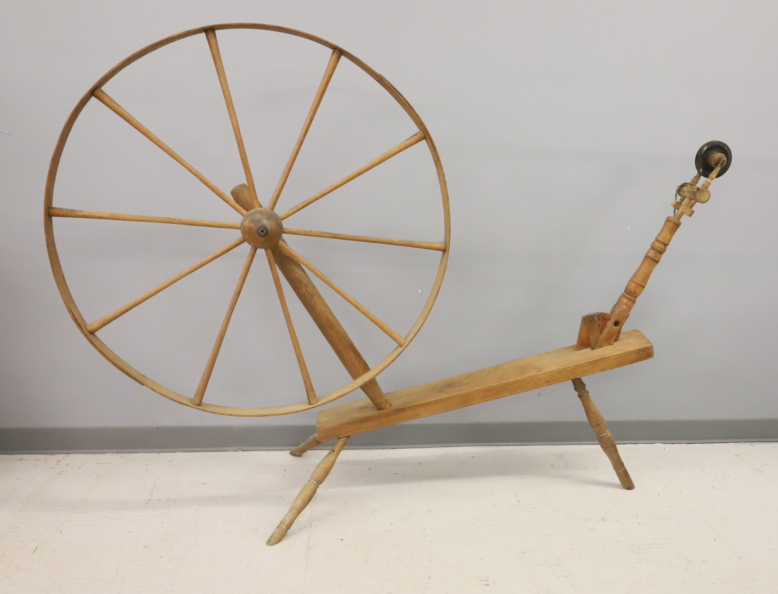 LARGE ANTIQUE SPINNING WHEEL: WHEEL IS 41" D. TOTAL SIZE 70" L. AS-FOUND. PLEASE READ CAREFULLY - ITEMS MUST BE PAID FOR THROUGH LIVE AUCTIONEERS OR WITH CASH OR CHECK IN PERSON - Terms for Purchasing and Shipping of Auction Items