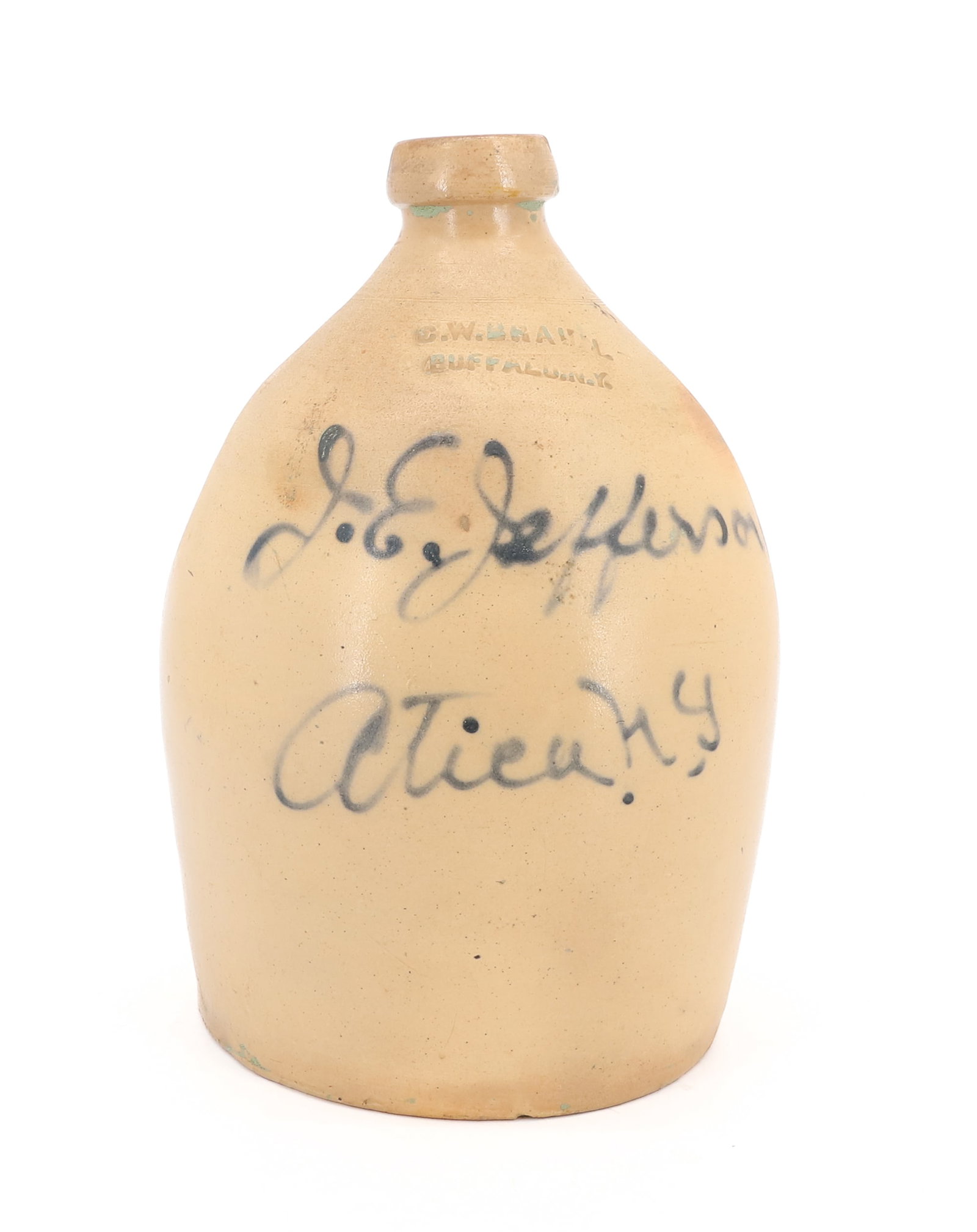 UTICA, NY STONEWARE ADVERTISING JUG: MRKD. "J.E. JEFFERSON ATICA (OR UTICA) N.Y." IMPRESSED C.W. BRAUN, BUFFALO, NY. 11 1/4" X 6 1/2". PLEASE READ CAREFULLY - ITEMS MUST BE PAID FOR THROUGH LIVE AUCTIONEERS OR WITH CASH OR CHECK IN PERSO