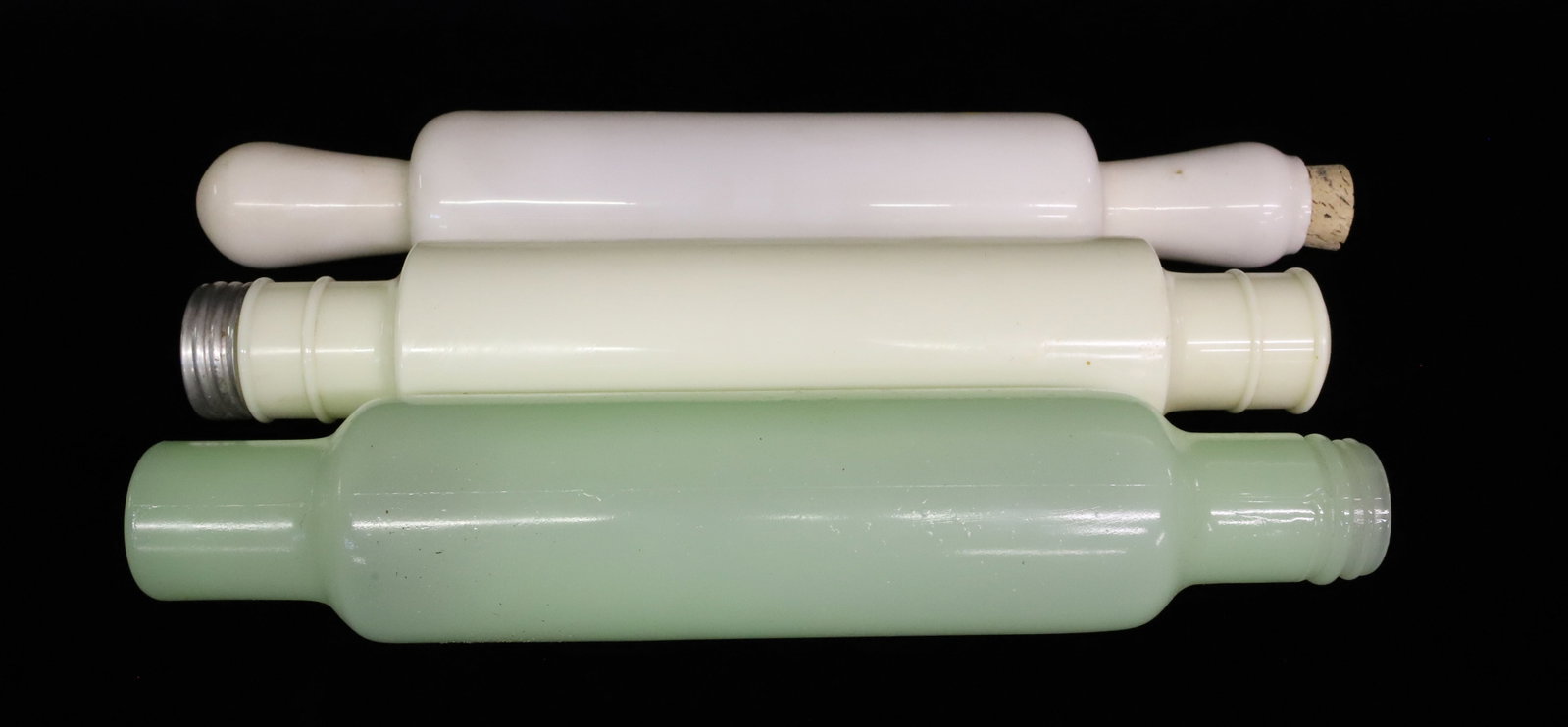 (3) VINTAGE GLASS ROLLING PINS: LIGHT GREEN (JADITE), WHITE AND CREAM. ONE HAS ALUMINUM CAP END. WHITE EXAMPLE 15" L. PLEASE READ CAREFULLY - ITEMS MUST BE PAID FOR THROUGH LIVE AUCTIONEERS OR WITH CASH OR CHECK IN PERSON - Terms