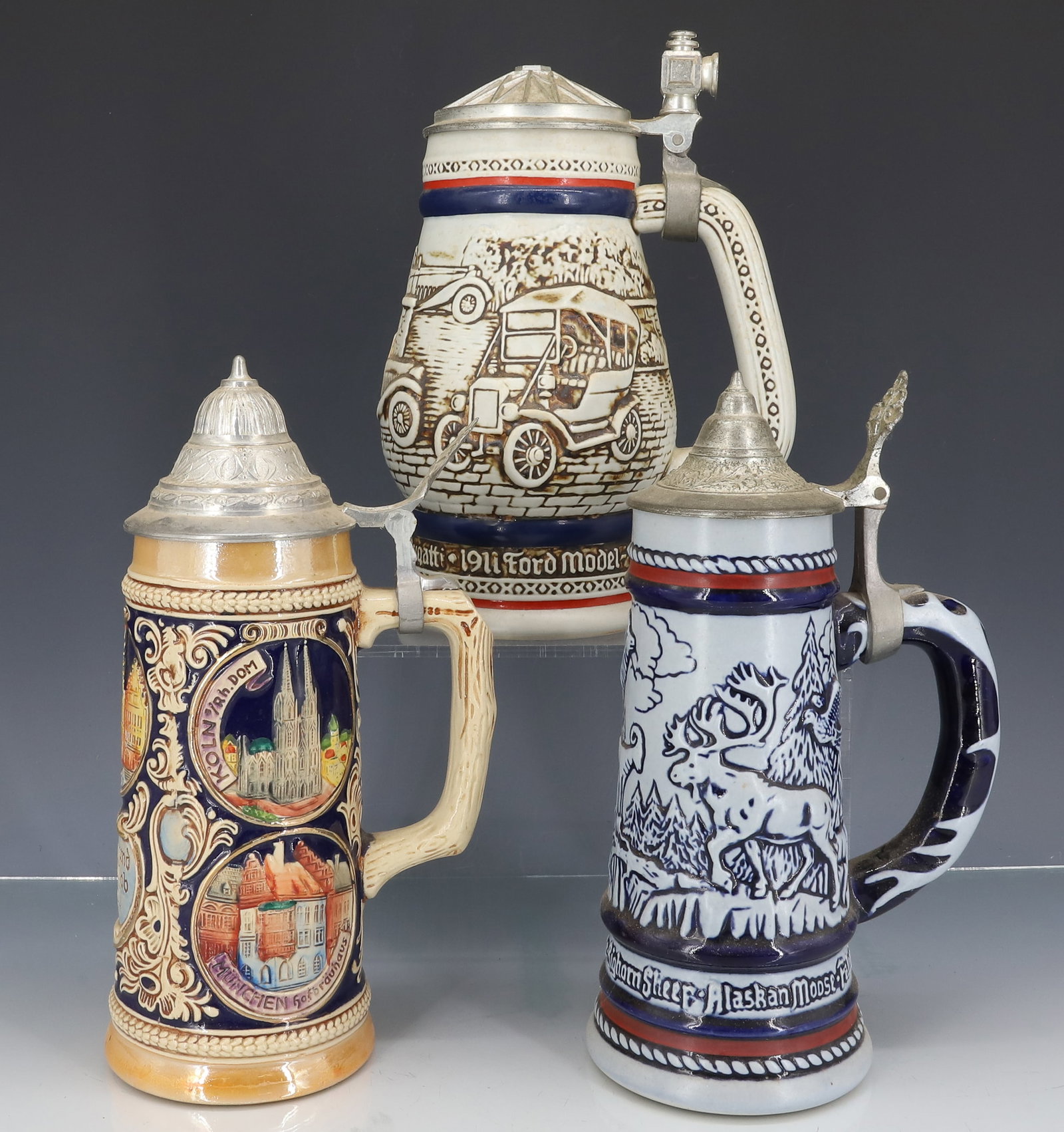 (3) VINTAGE STEINS: TALLEST IN BROWN IS MRKD. "GERZ, WEST GERMANY" 9 3/8" H. THE OTHER TWO MRKD. AVON (MADE IN BRAZIL). WITH COLOGNE INSIDE OF BOTH. PLEASE READ CAREFULLY - ITEMS MUST BE PAID FOR THROUGH LIVE