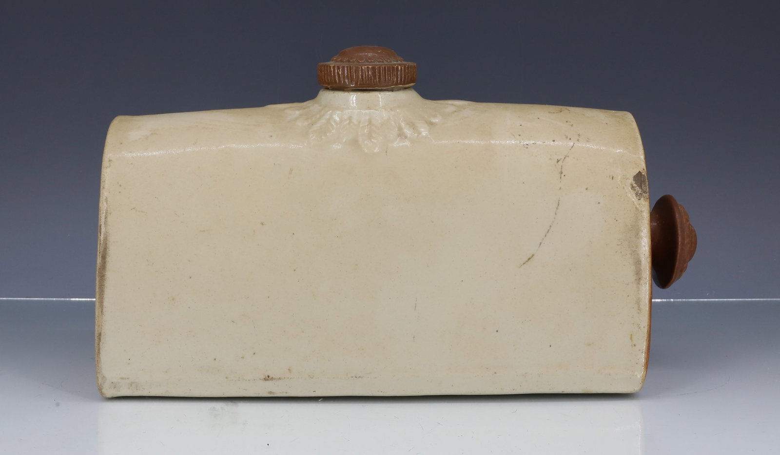 ENGLISH POTTERY FOOT WARMER: WHITE / BROWN GLAZE. POTTERY SCREW-TOP. MRKD. "DENBY DERBY BOURNE" 12" L. PLEASE READ CAREFULLY - ITEMS MUST BE PAID FOR THROUGH LIVE AUCTIONEERS OR WITH CASH OR CHECK IN PERSON - Terms for Purchasing