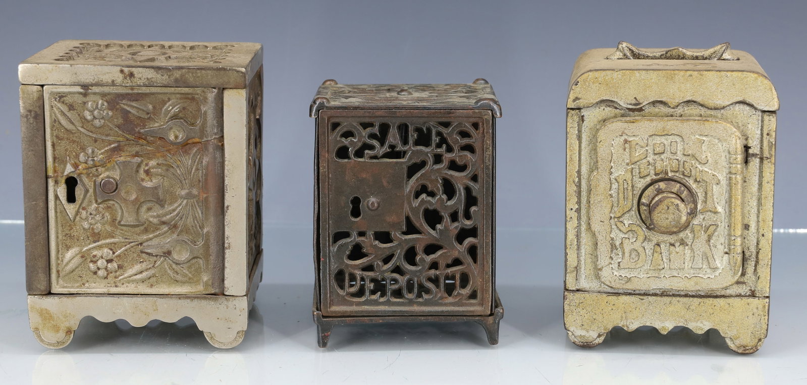 (3) CAST IRON SAFE BANKS (1 of 6)