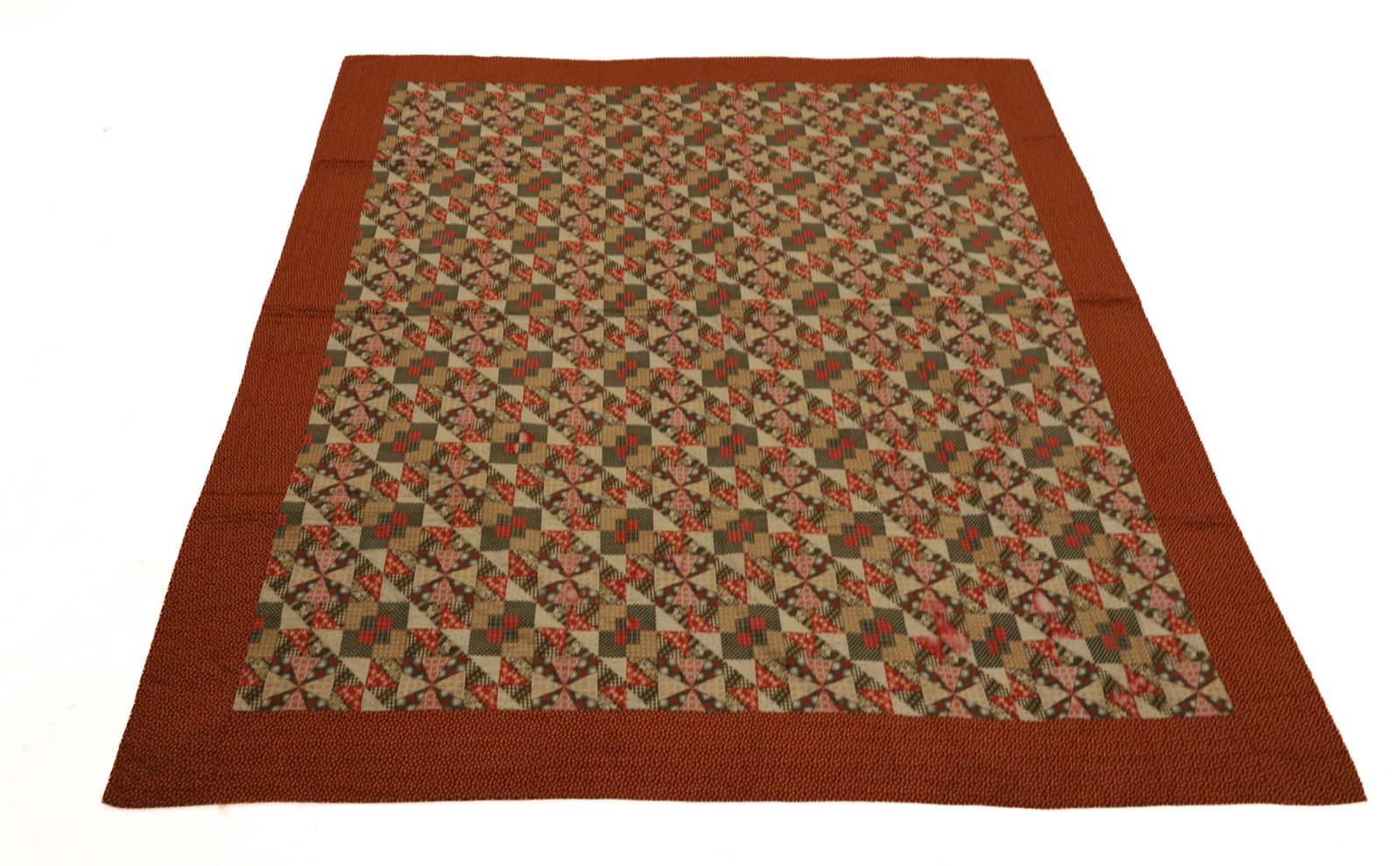VINTAGE HAND STITCHED QUILT: VARIOUS COLORS AND FABRICS. PRINTED BACKING. HAS CONTEMPORARY HANG POCKET. 72" X 77". PLEASE READ CAREFULLY - ITEMS MUST BE PAID FOR THROUGH LIVE AUCTIONEERS OR WITH CASH OR CHECK IN PERSON - Terms fo