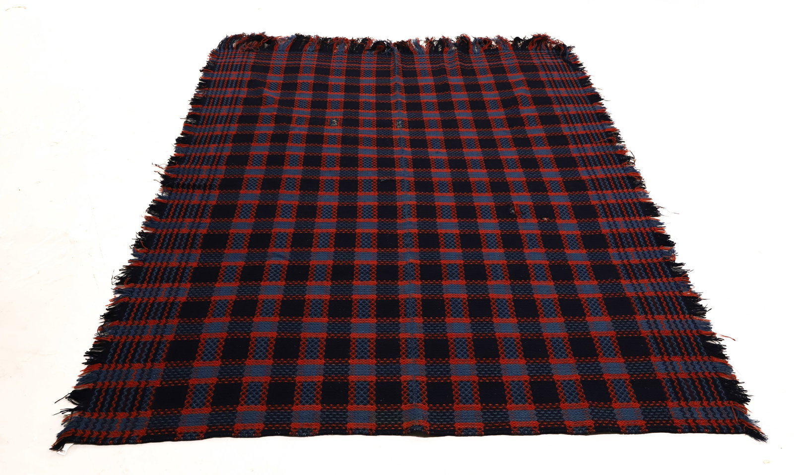 19TH C. TWO-PIECE WOVEN COVERLET: NAVY / BLUE / RED IN GRID PATTERN WITH WAVY BORDER. FRINGE EDGE. 74" X 84". PLEASE READ CAREFULLY - ITEMS MUST BE PAID FOR THROUGH LIVE AUCTIONEERS OR WITH CASH OR CHECK IN PERSON - Terms for