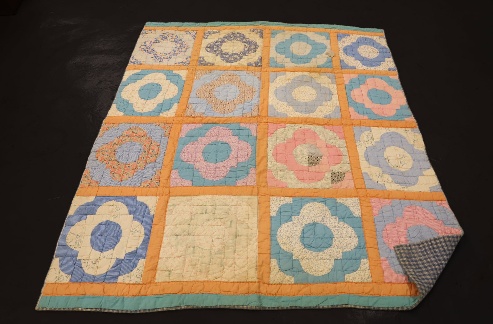 HAND STITCHED VINTAGE QUILT: VARIOUS COLORS AND PATTERNS. FEED SACK MATERIAL. 78" X 67". THICK BATTING. PLEASE READ CAREFULLY - ITEMS MUST BE PAID FOR THROUGH LIVE AUCTIONEERS OR WITH CASH OR CHECK IN PERSON - Terms for