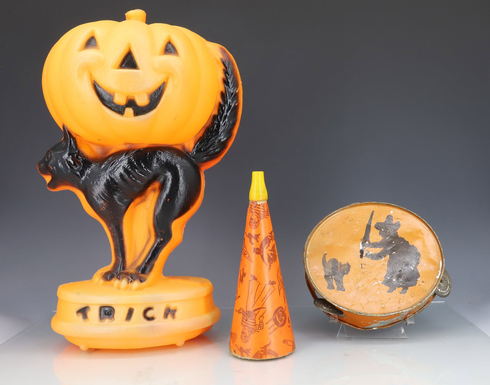 LOT OF VINTAGE HALLOWEEN ITEMS: INCLUDING: BLOW MOLD PUMPKIN / CAT "TRICK TREAT" MRKD. GENERAL FOAM PLASTICS. 14 1/4 H. CARDBOARD HORN "BROOKWOOD MILLS" 7 1/2". PAINTED METAL TAMBOURINE 6 1/8" D. PLEASE READ CAREFULLY - ITEMS MUST B