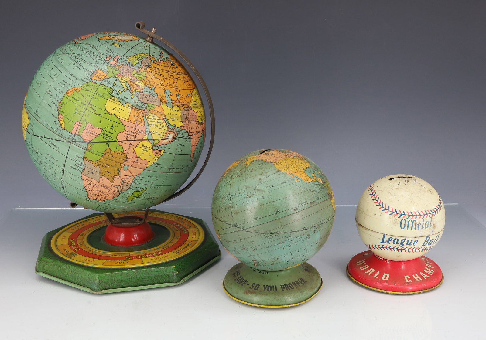 TIN LITHO GLOBE AND BANKS: J. CHEIN GLOBE ON OCTAGONAL BASE. 8 3/4" H. OHIO ART "WORLD BANK" 4 3/4" H. WITH, OHIO ART BASEBALL "WORLD CHAMPION" BANK. 3 3/4" H. PLEASE READ CAREFULLY - ITEMS MUST BE PAID FOR THROUGH LIVE