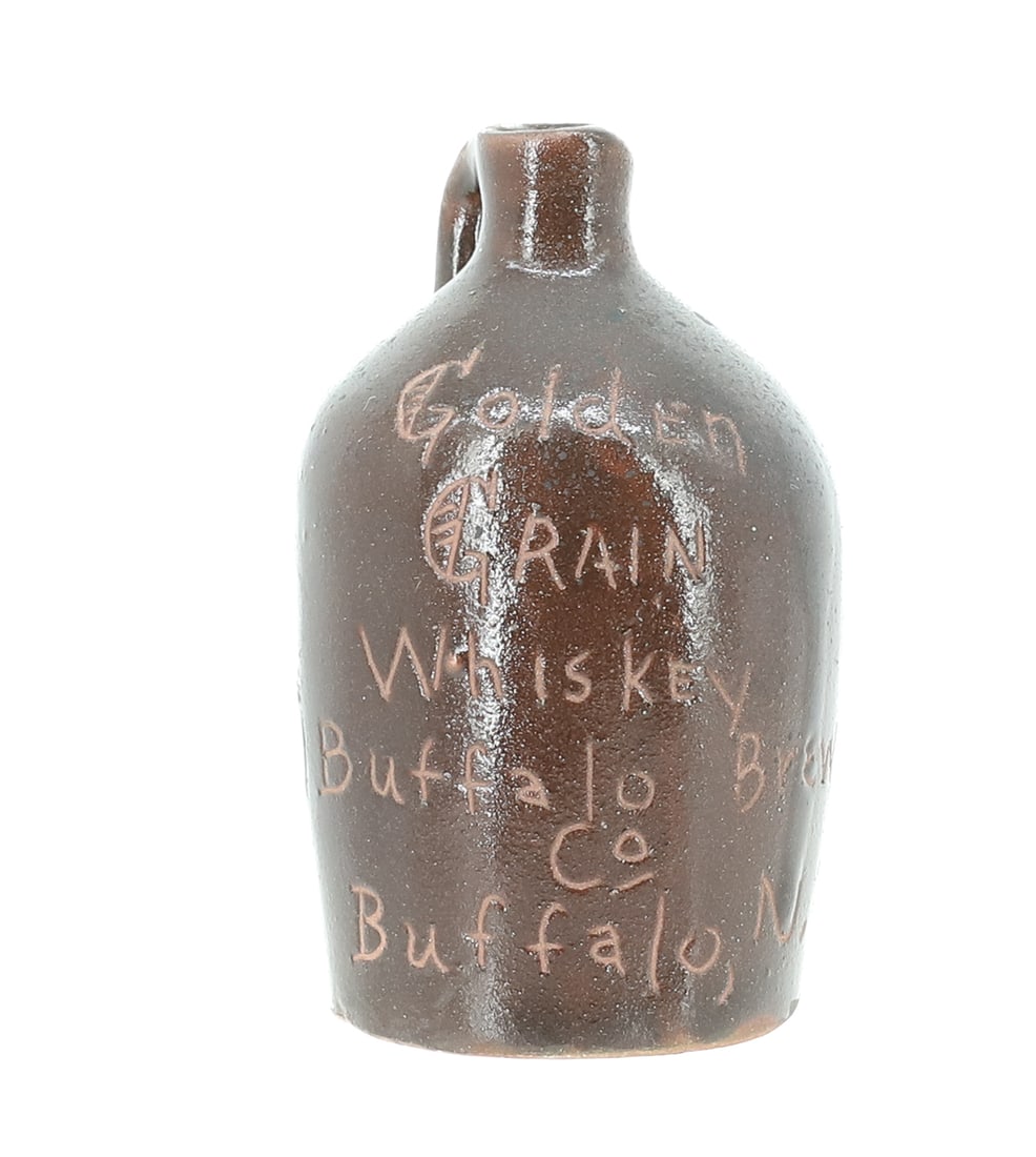 MINIATURE "BUFFALO, NY" SCRATCH JUG: ALBANY BROWN GLAZE "GOLDEN GRAIN WHISKEY BUFFALO BREWING CO. BUFFALO, N.Y." 3" H. PLEASE READ CAREFULLY - ITEMS MUST BE PAID FOR THROUGH LIVE AUCTIONEERS OR WITH CASH OR CHECK IN PERSON - Terms for