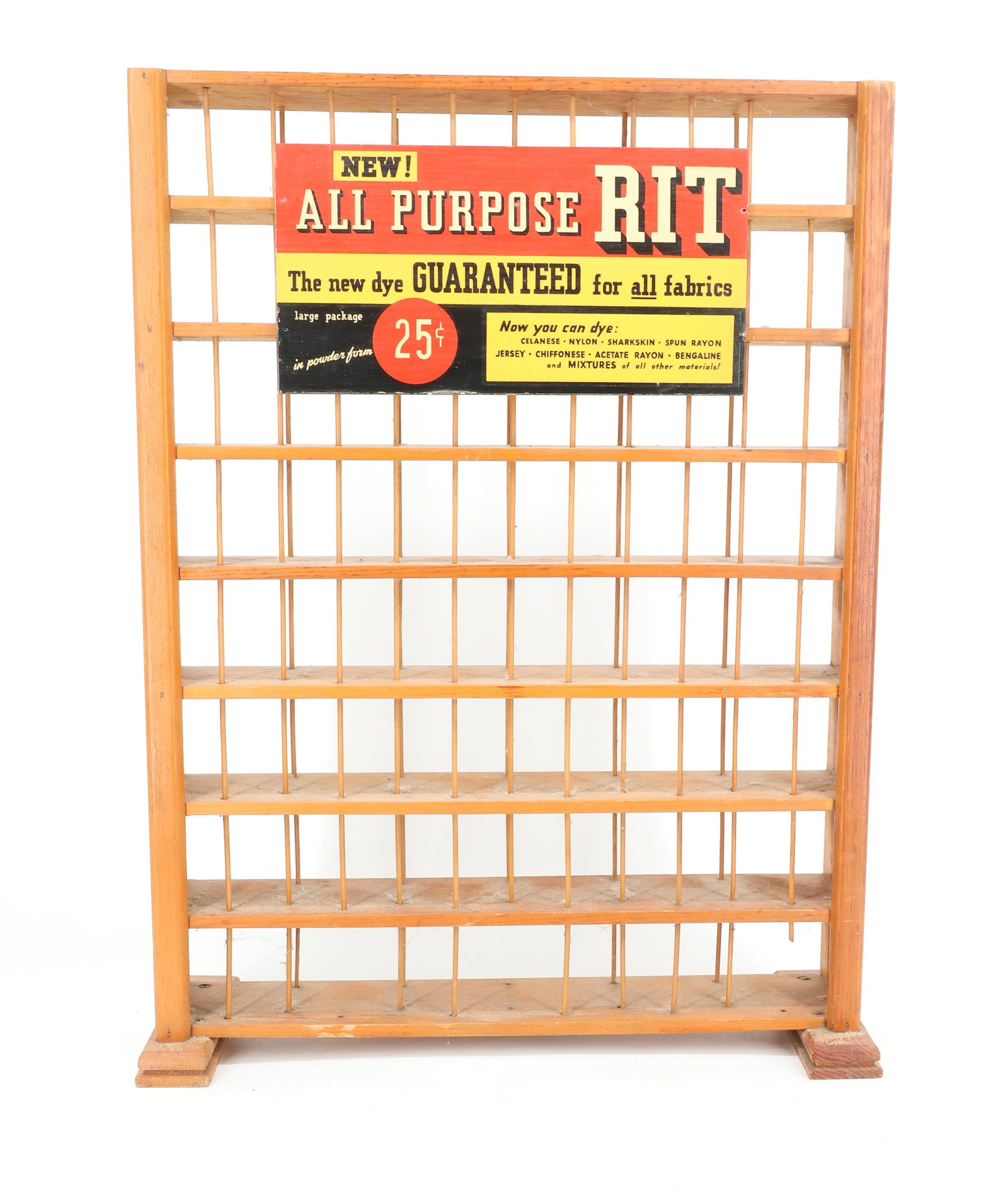 WOODEN ADVERTISING DISPLAY "RIT DYES": WOODEN DIVIDED DISPLAY WITH PLACARD. "ALL PURPOSE RIT, THE NEW DYE GUARANTEED FOR ALL FABRICS" 23" X 17". COLORS STAMPED ON BACK. PLEASE READ CAREFULLY - ITEMS MUST BE PAID FOR THROUGH LIVE AUCTIONEER