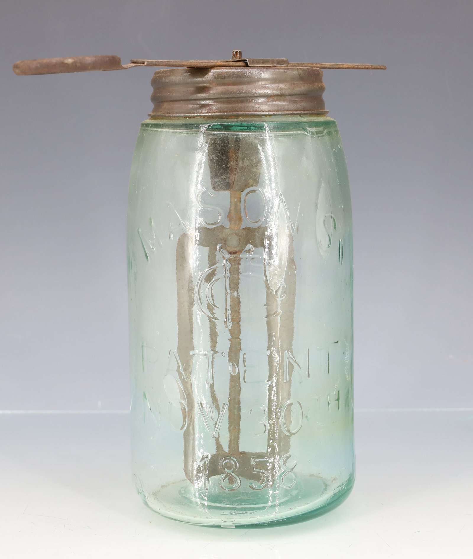 UNUSUAL "FAVORITE" BUTTER MERGER, WHIP: CAST IRON/METAL SCREW-IN TOP. AQUA MASON JAR. 7" X 7 1/2". PLEASE READ CAREFULLY - ITEMS MUST BE PAID FOR THROUGH LIVE AUCTIONEERS OR WITH CASH OR CHECK IN PERSON - Terms for Purchasing and Shipping o