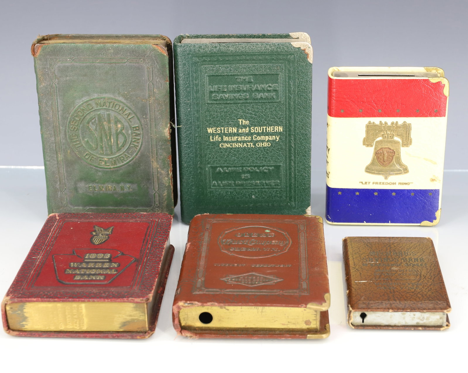 (6) VINTAGE BOOK BANKS: SAVE FOR LIFE, LIBERTY AND THE PURSUIT OF HAPPINESS. MECHANICS SAVINGS BANK. WARREN NATIONAL BANK. THE SECOND NATIONAL BANK OF ELMIRA, NY. AND MORE. PLEASE READ CAREFULLY - ITEMS MUST BE PAID FOR