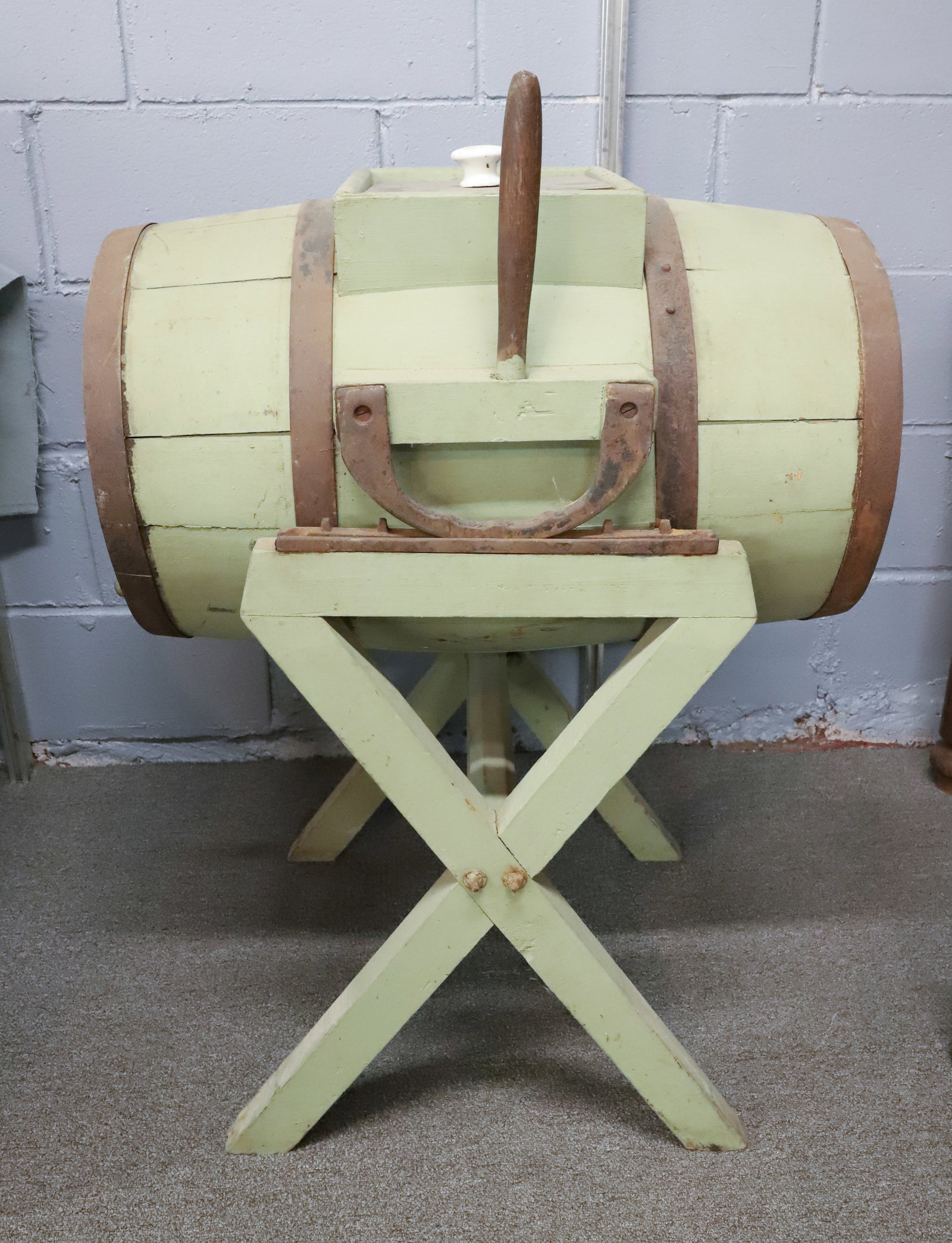 PAINTED WOODEN BARREL BUTTER CHURN: IMPROVED BUCKEYE BARREL SHAPED CHURN ON WOODEN FRAME. ROCKS ON CAST IRON TRACK. 36 1/2" X 19" X 24". PLEASE READ CAREFULLY - ITEMS MUST BE PAID FOR THROUGH LIVE AUCTIONEERS OR WITH CASH OR CHECK IN PE